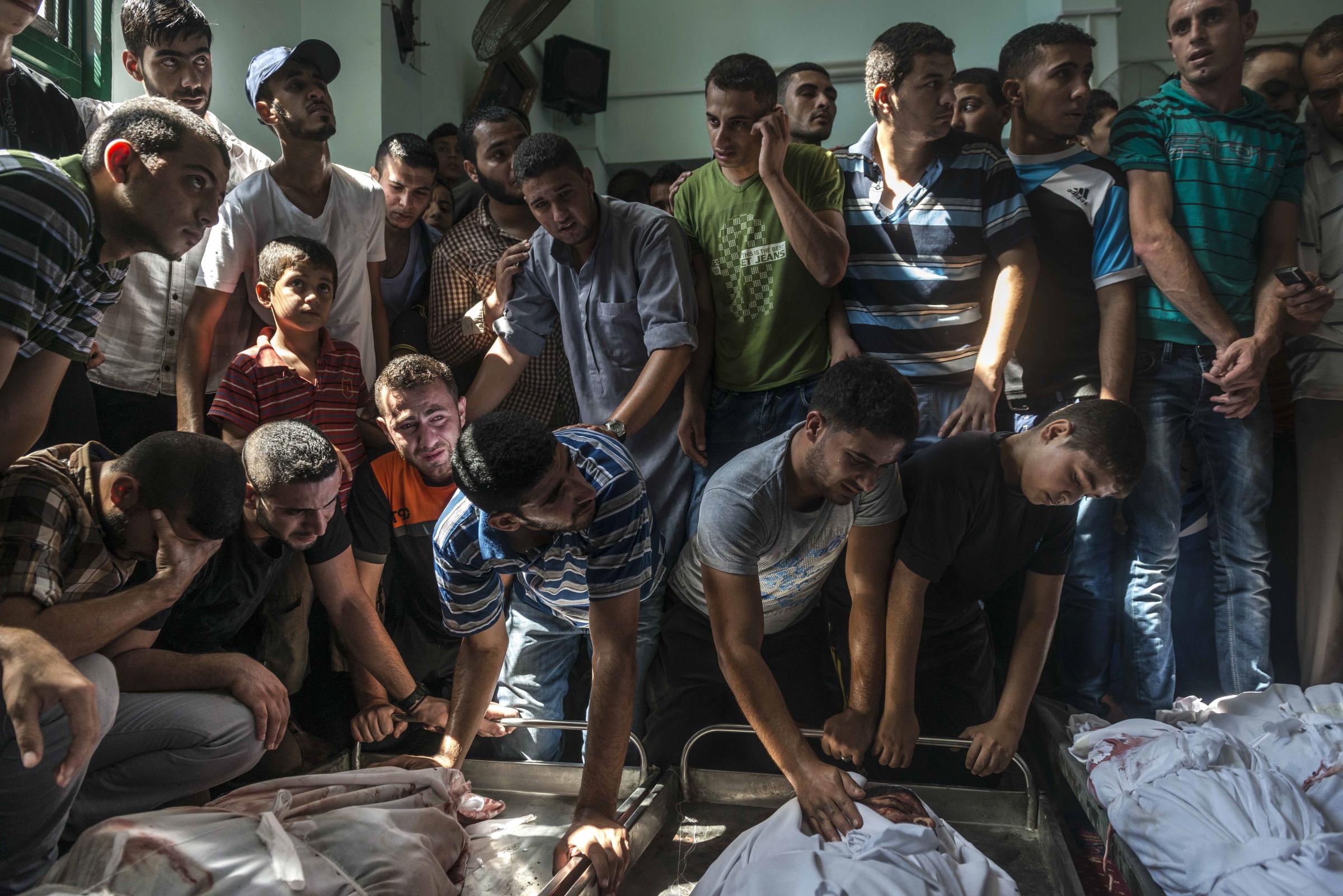 Palestinians mourn over the Nigim family, reportedly killed in an airstrike in Jabaliya on the Gaza Strip.