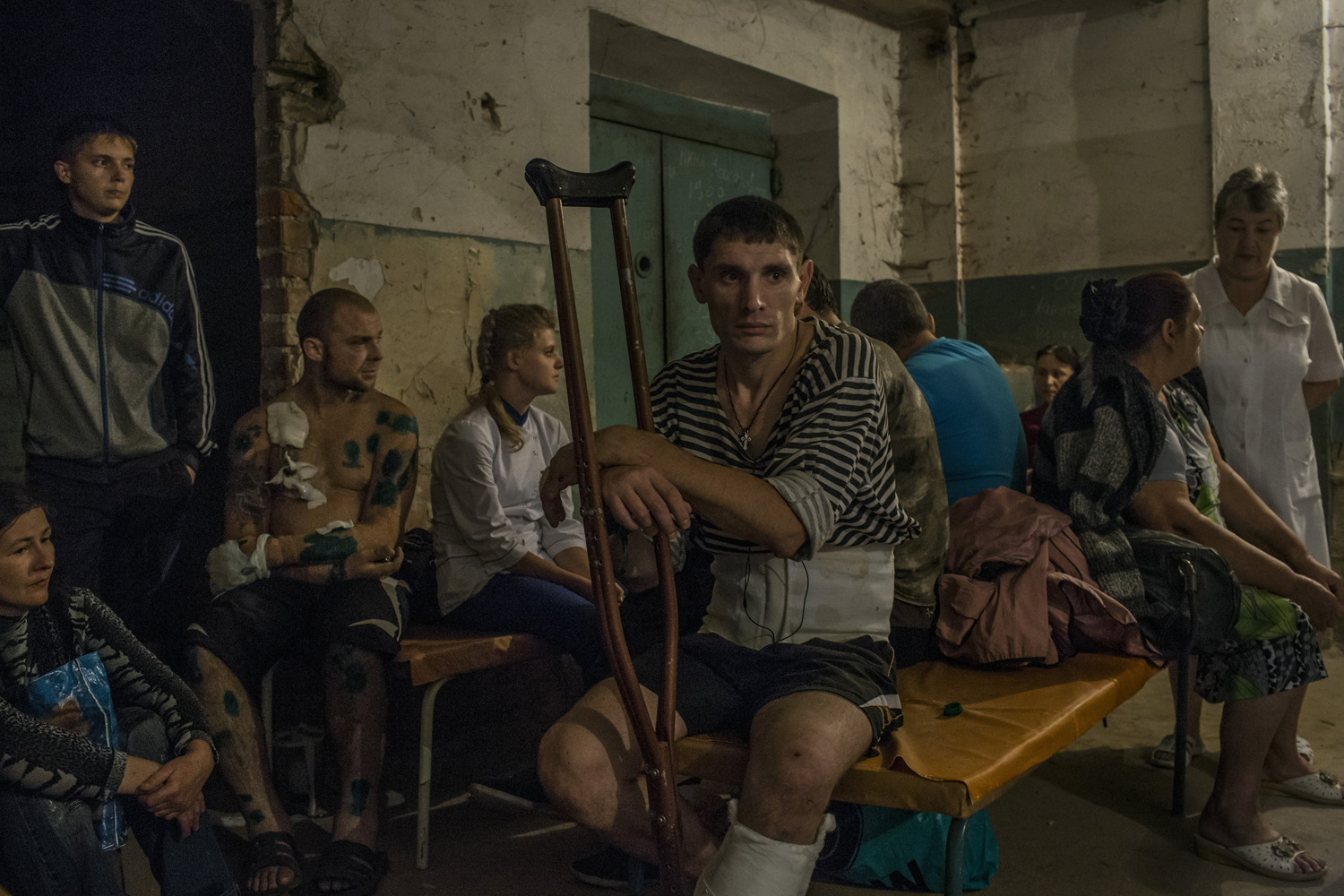 Patients and relatives gather at a hospital basement after an early-morning shelling that hit the hospital compound in central Donetsk, Ukraine