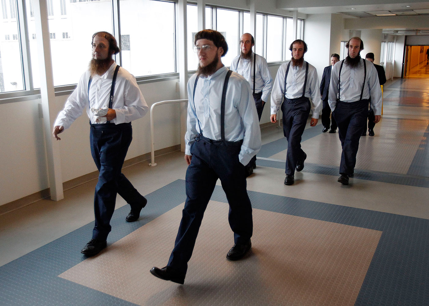 Members of the Amish community leave the Cleveland, Ohio federal courthouse during the trial of a breakaway Amish community in eastern Ohio, led by Samuel Mullet Sr., at the federal courthouse in Cleveland, Aug. 27, 2012. (David Maxwell—EPA)