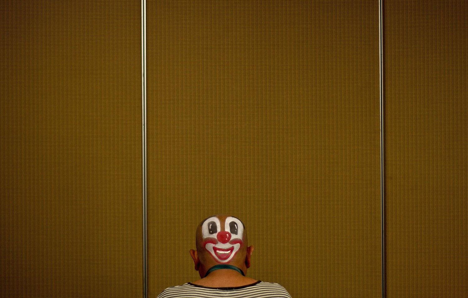 A clown prepares to take part in a Clown Festival in Kuala Lumpur on Aug. 17, 2014.