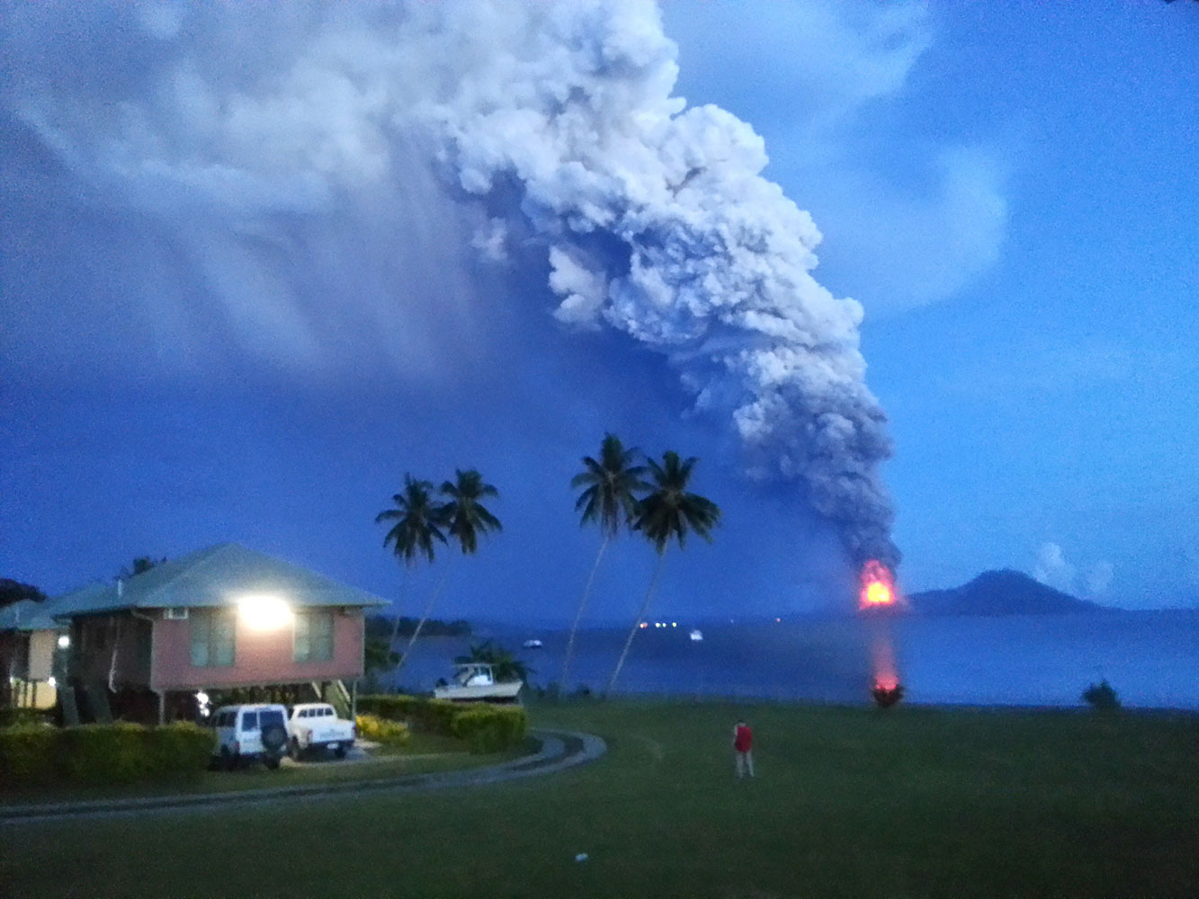A photo taken on August 29, 2014, shows Mount Tavurvur erupting in eastern Papua New Guinea, spewing rocks and ash into the air, forcing the evacuation of local communities and international flights to be re-routed. (Joyce Lessimanuaja—AFP/Getty Images)
