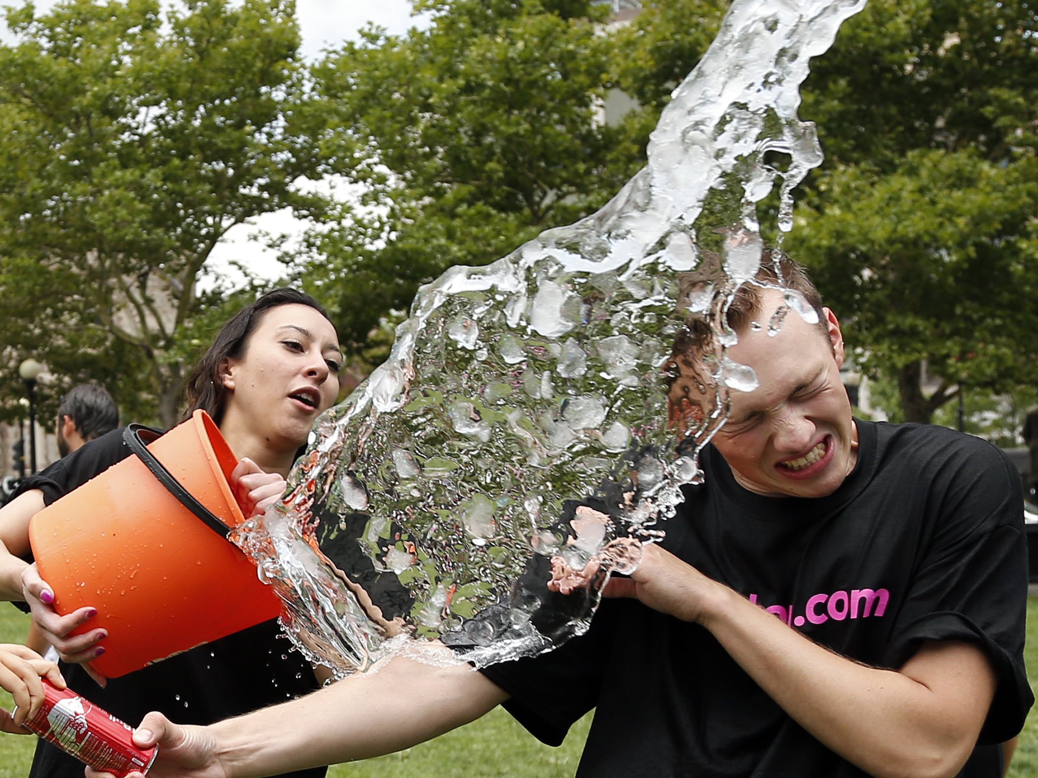 Beryl Lipton douses Matt Lee during the ice bucket challenge at Boston's Copley Square on August 7, 2014 to raise funds and awareness for ALS.