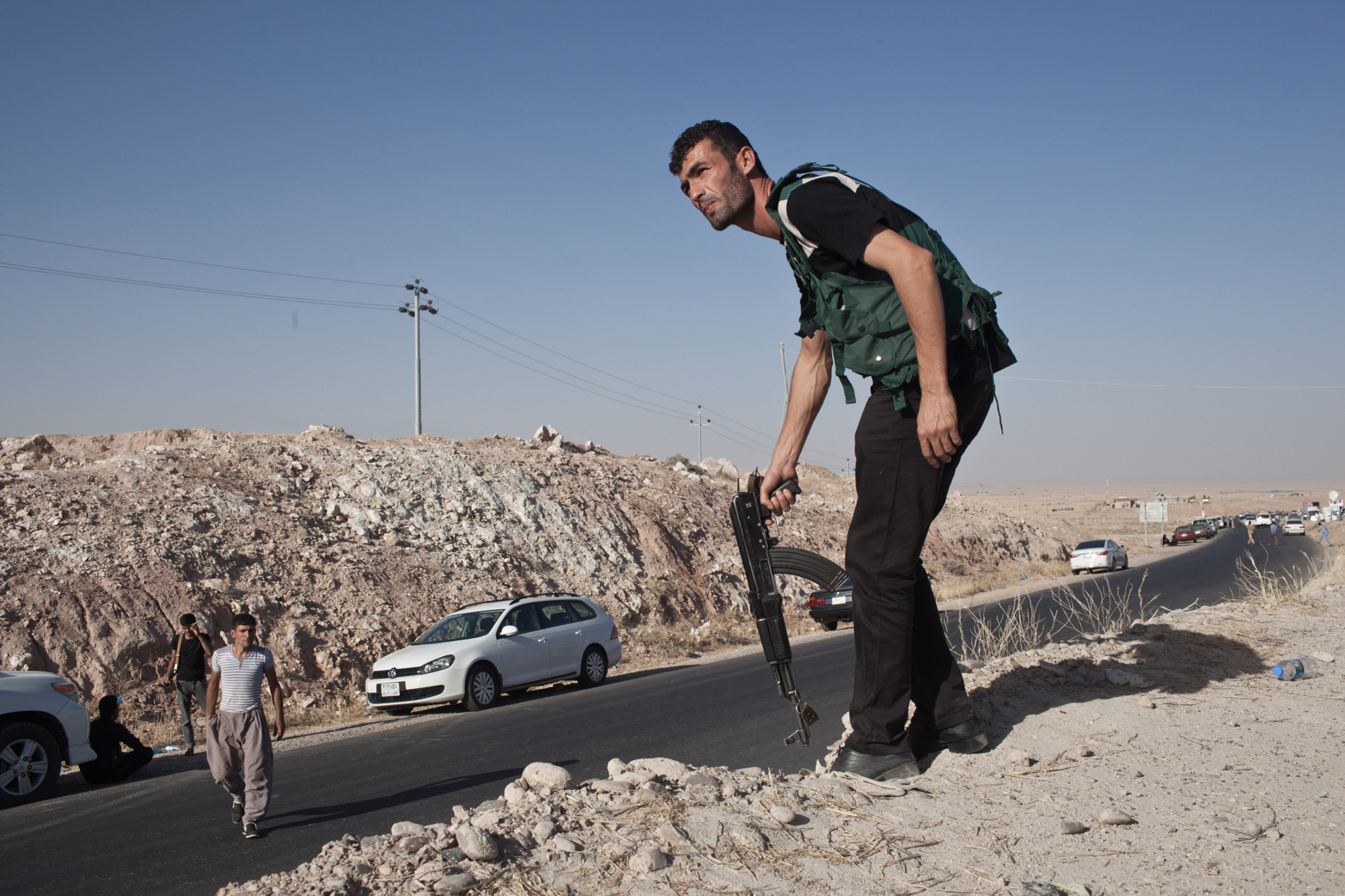 Kurdish military volunteers amass near the frontline at the outskirts of the town of Makhmor, 35 miles south of Erbil, the capital of the Kurdish Region of Iraq, Aug. 9. 2014.