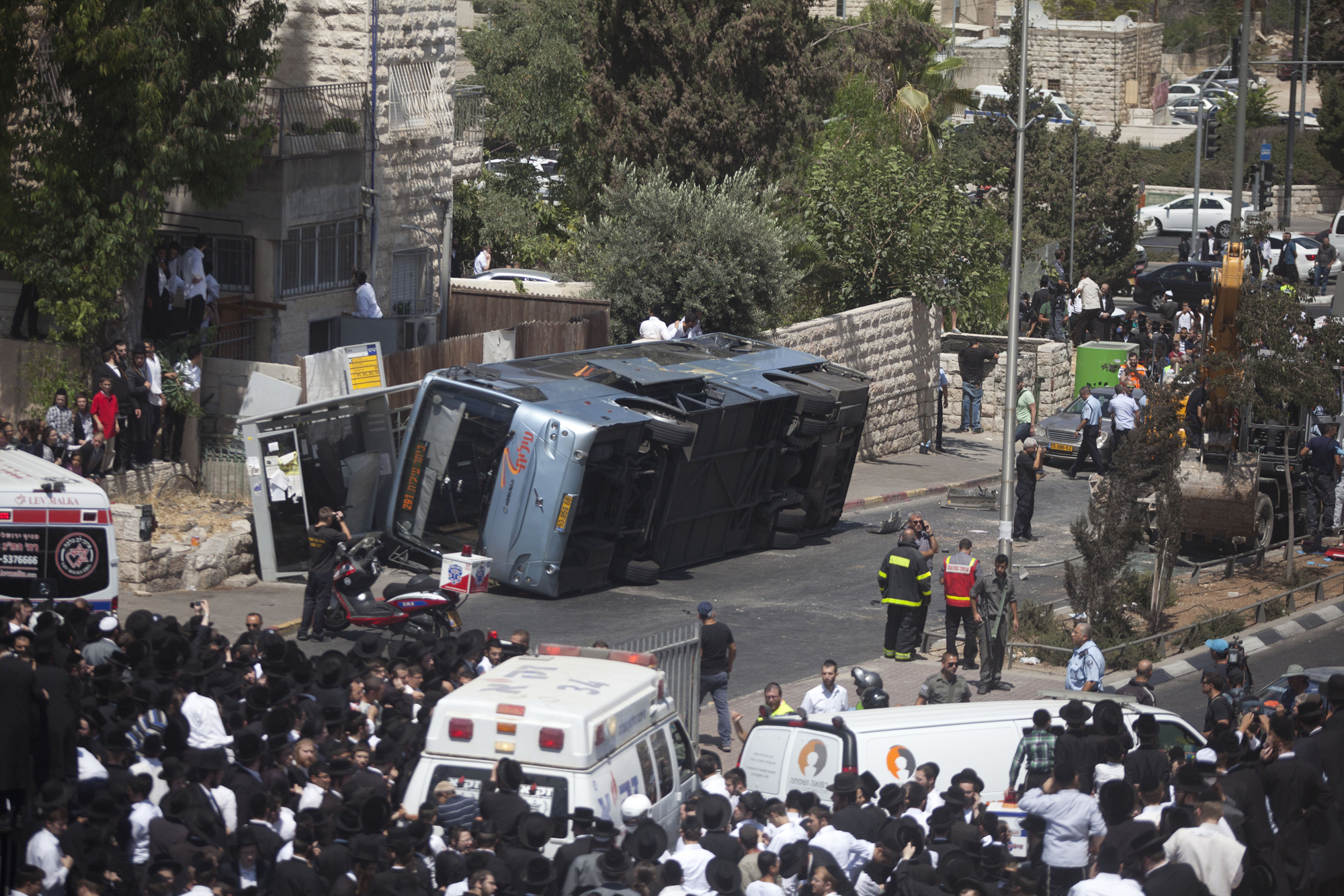 A bus after a Palestinian man in an excavator into it on Aug. 4. 2014 in Jerusalem.