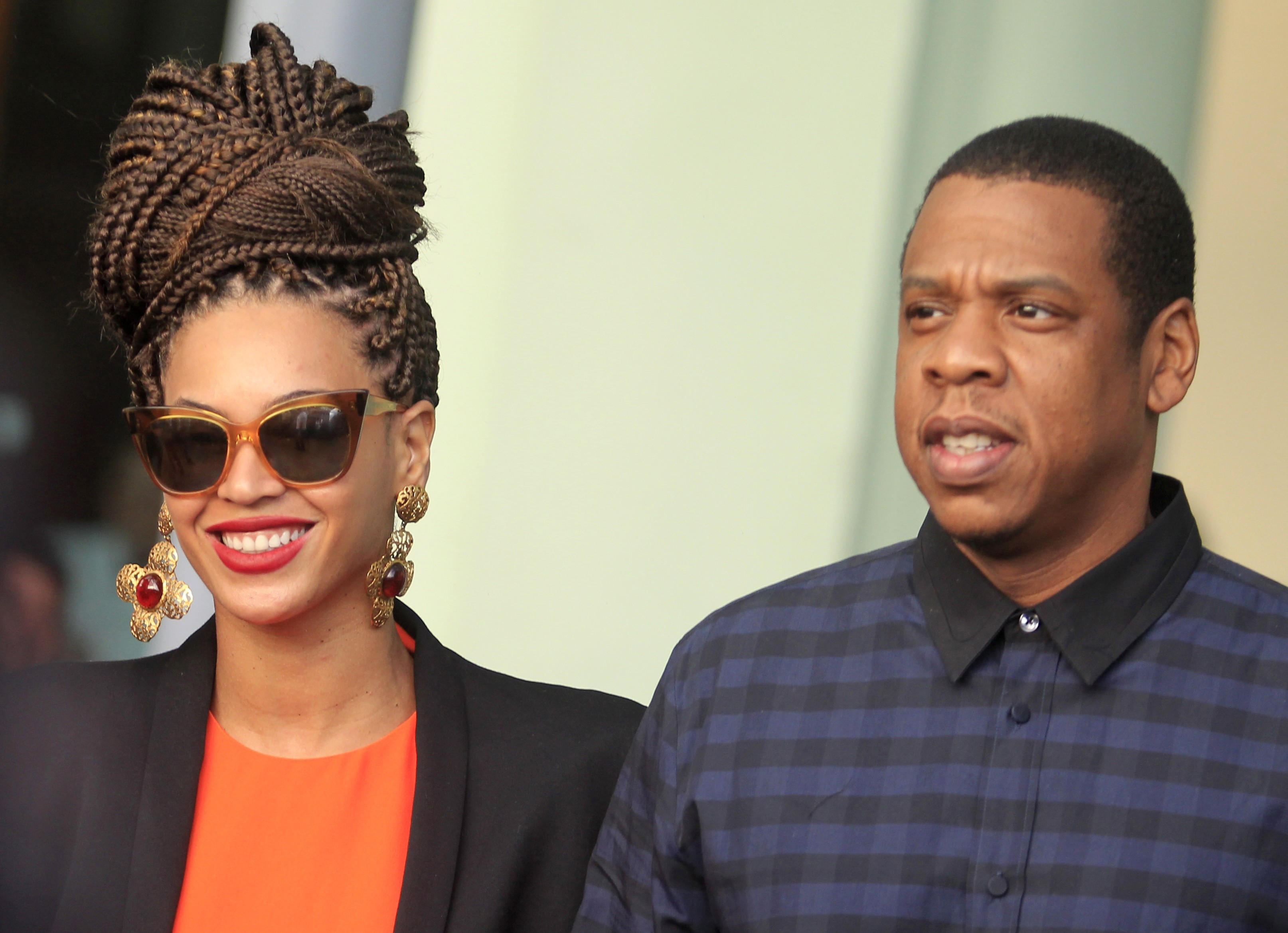 U.S. singer Beyonce and her husband rapper Jay-Z walk as they leave their hotel in Havana on April 4, 2013. (Enrique De La Osa—Reuters/Corbis)