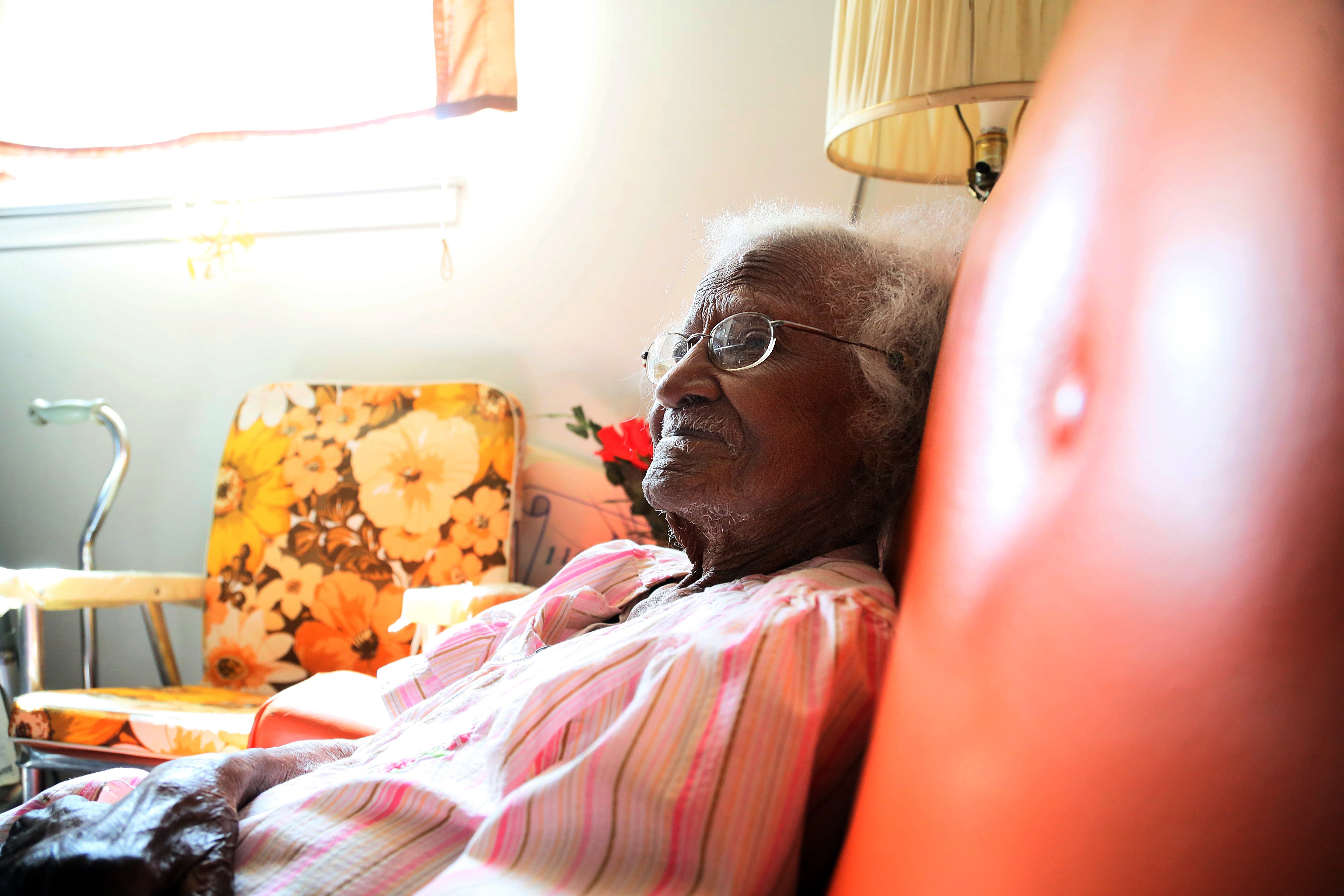 Jeralean Talley, photographed at 113, sits in her favorite chair in the living room of her home in Inkster, Mich. on April 2, 2013. She is now 115.