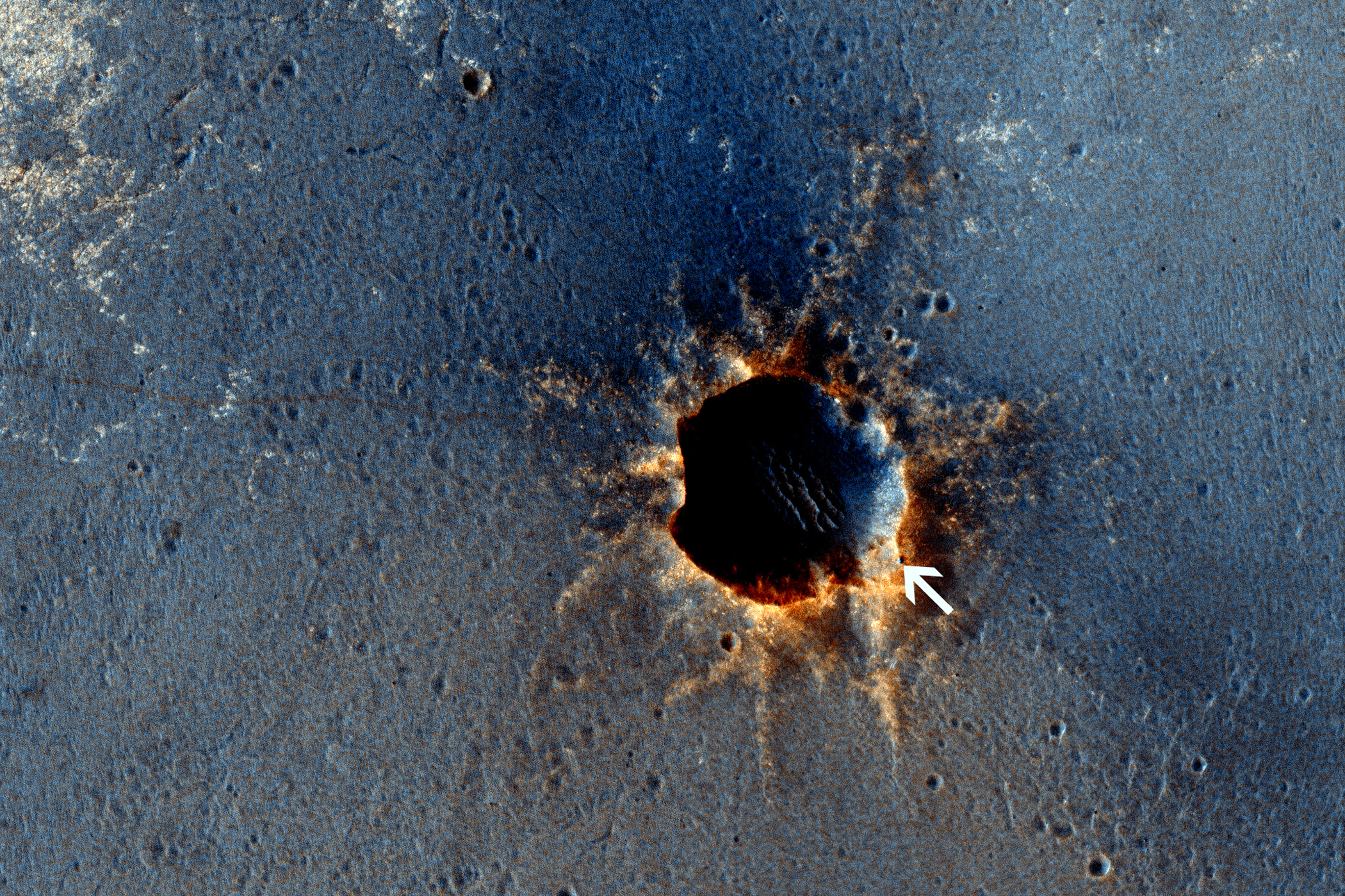 HiRISE acquired this color image of Santa Maria Crater, with the Opportunity rover perched on the southeast rim. Rover tracks are clearly visible to the east.Opportunity has been studying this relatively fresh 90 meter diameter crater to better understand how crater excavation occurred during the impact and how it has been modified by weathering and erosion since.
