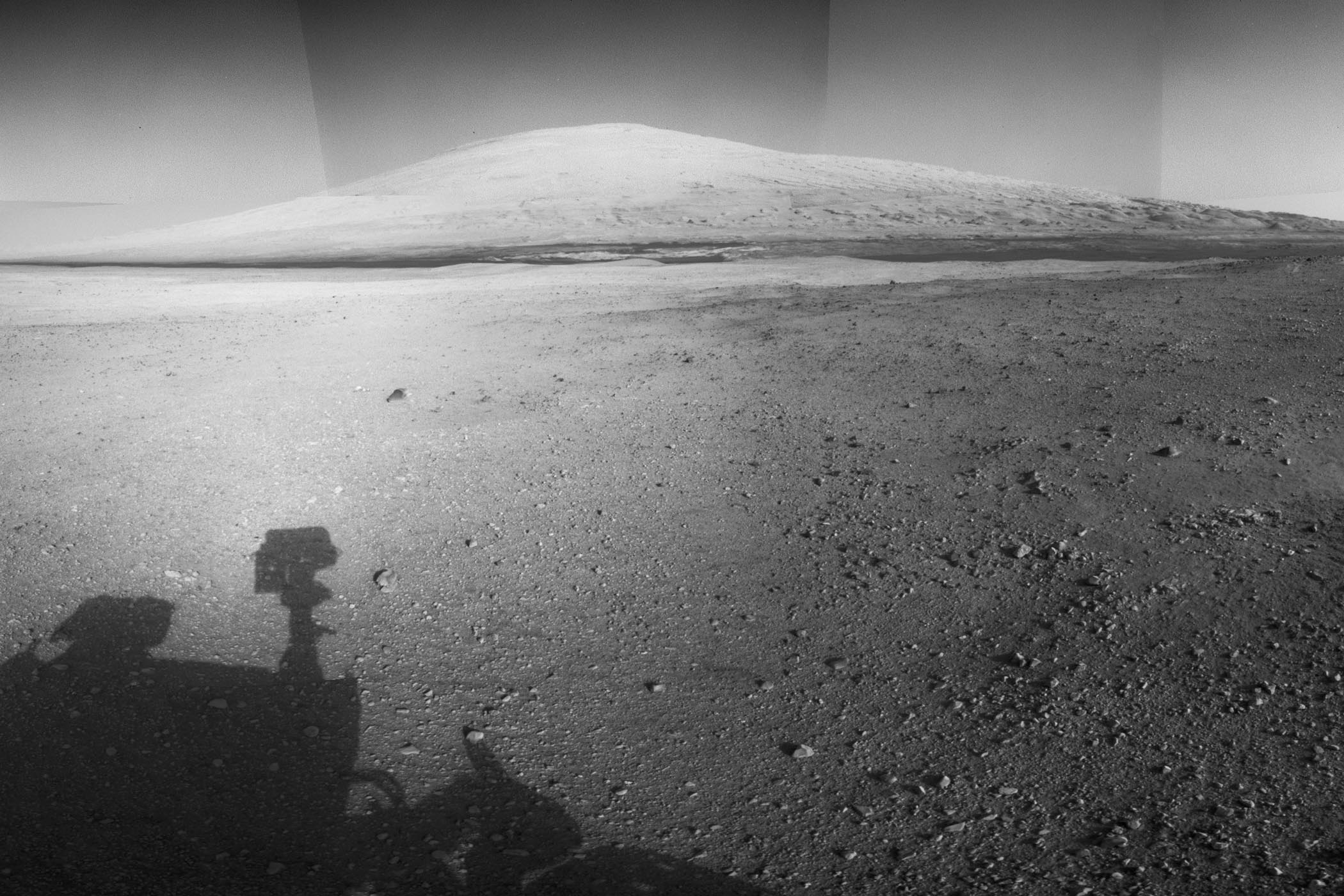The highest point on Mount Sharp is visible from the Curiosity rover on Aug. 18, 2012. The Martian mountain rises 3.4 miles above the floor of Gale Crater. Geological deposits near the base of Mount Sharp are the destination of Curiosity's Mars mission.