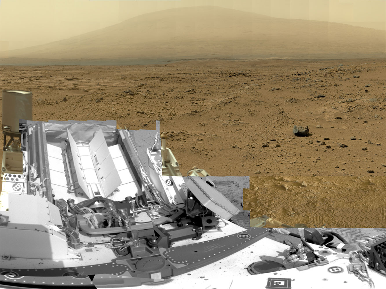A full-circle view released by NASA on June 20, 2013, combined nearly 900 images taken by NASA's Curiosity Mars rover, generating a panorama with 1.3 billion pixels in the full-resolution version. The view is centered toward the south, with north at both ends. It shows NASA's Mars rover Curiosity at the 'Rocknest' site where the rover scooped up samples of windblown dust and sand.