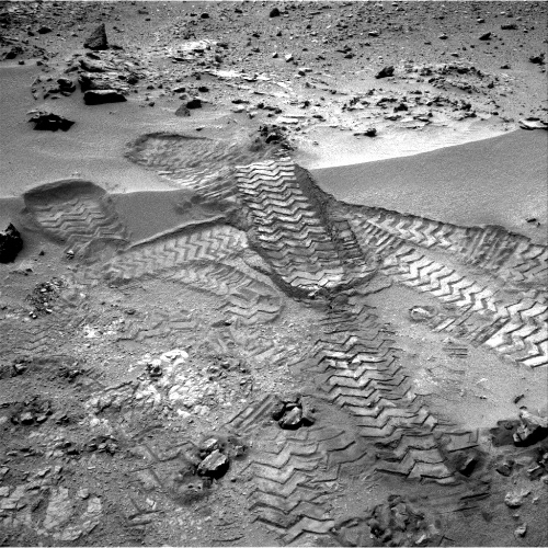 Curiosity's tracks was taken by Navcam onboard NASA's Mars rover Curiosity, on Nov. 18 2012.