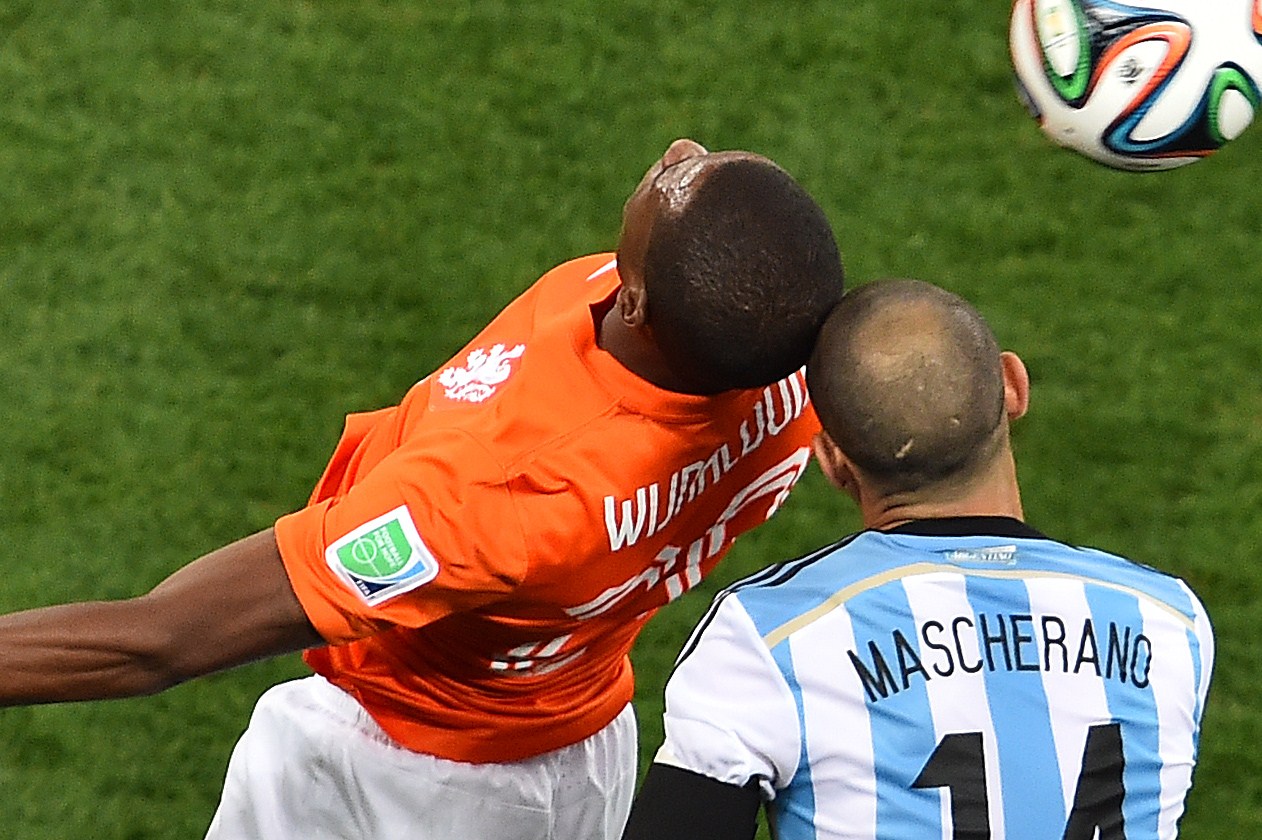 Argentina's midfielder Javier Mascherano (R) clashes heads with Netherlands' midfielder Georginio Wijnaldum resulting in Mascherano being taken off during the semi-final football match of the 2014 FIFA World Cup between Netherlands and Argentina at The Corinthians Arena in Sao Paulo on July 9, 2014. (Gabriel Bouys—AFP/Getty Images)
