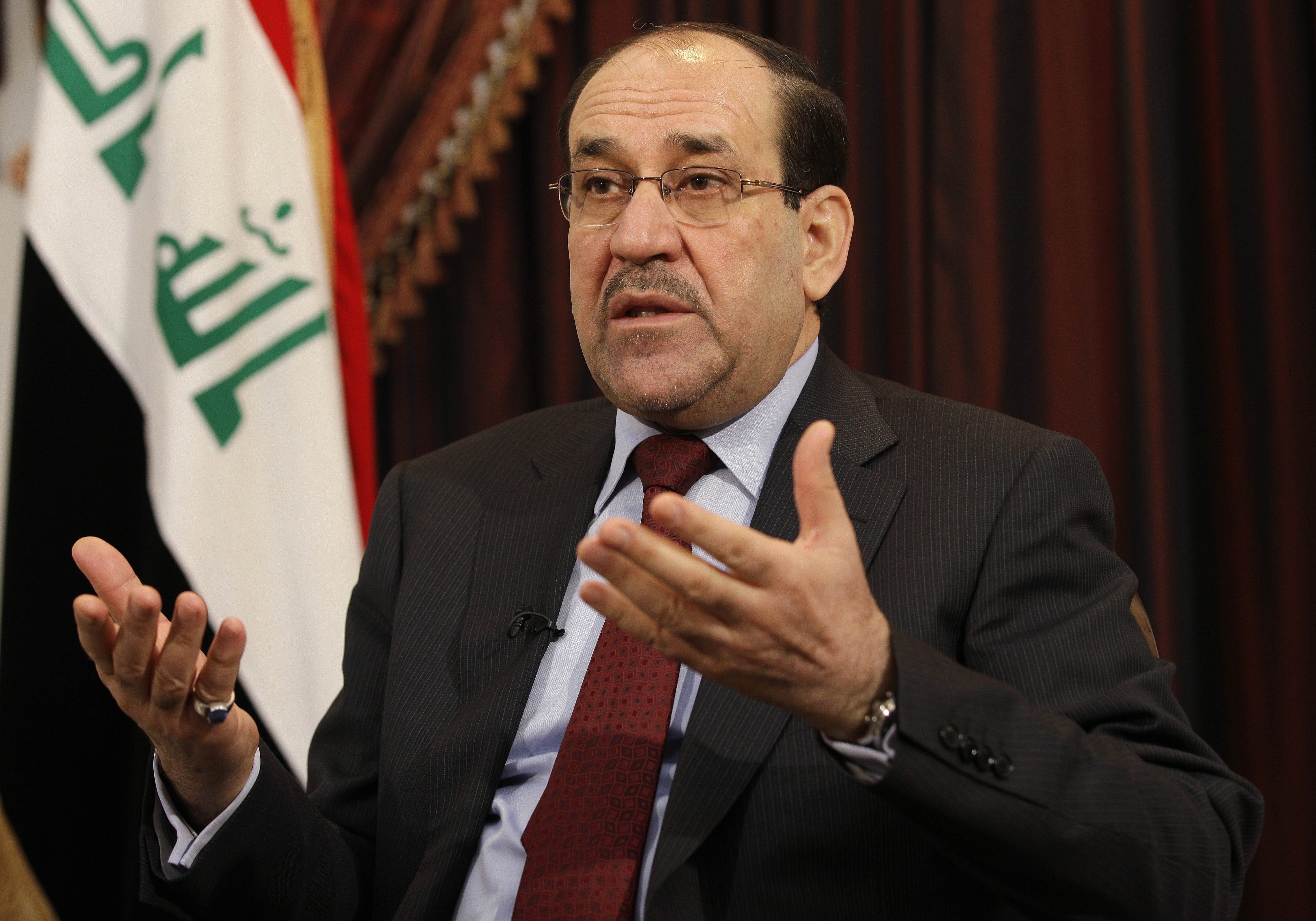 Iraq's Prime Minister Nouri al-Maliki speaks during an interview with the Associated Press in Baghdad on Dec. 3, 2011 (Hadi Mizban—AP)