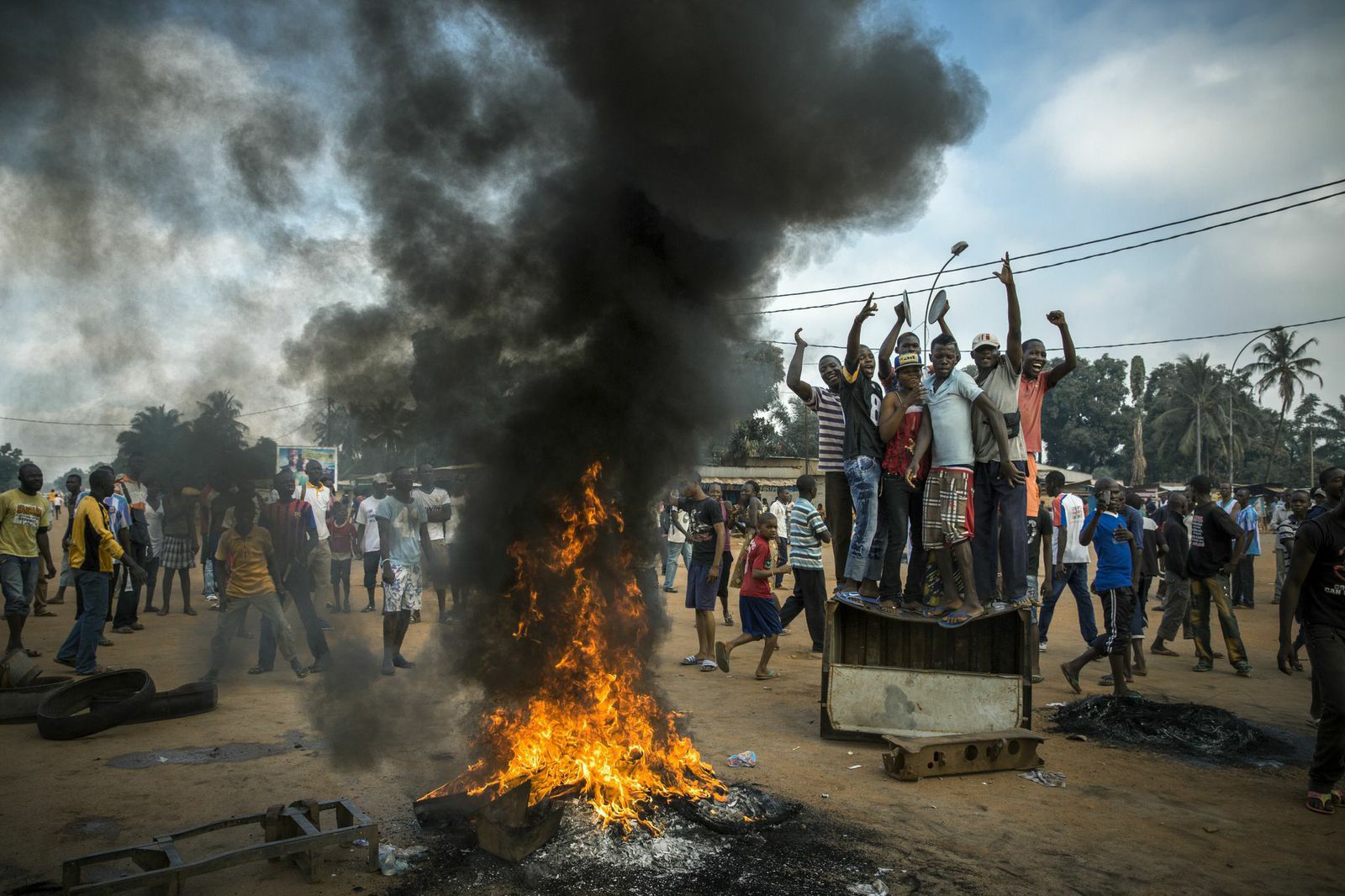 Demonstrators gather on a street in Bangui, the capital, to call for the resignation of interim president Michel Djotodia following the murder of Judge Modeste Martineau Bria by members of the Seleka. Bangui, Central African Republic.