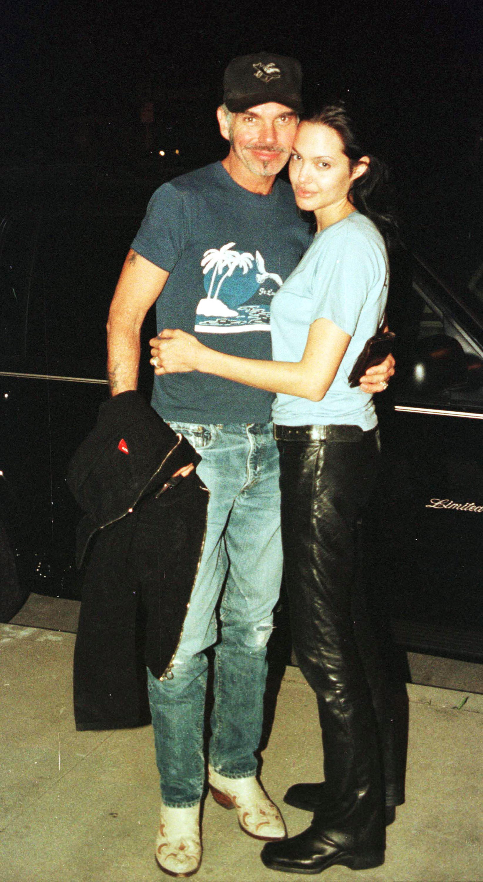 Newly married Billy Bob Thornton and Angelina Jolie pose for a photographer outside Jerry''s Famous Deli on June 3, 2000 in Studio City, CA.