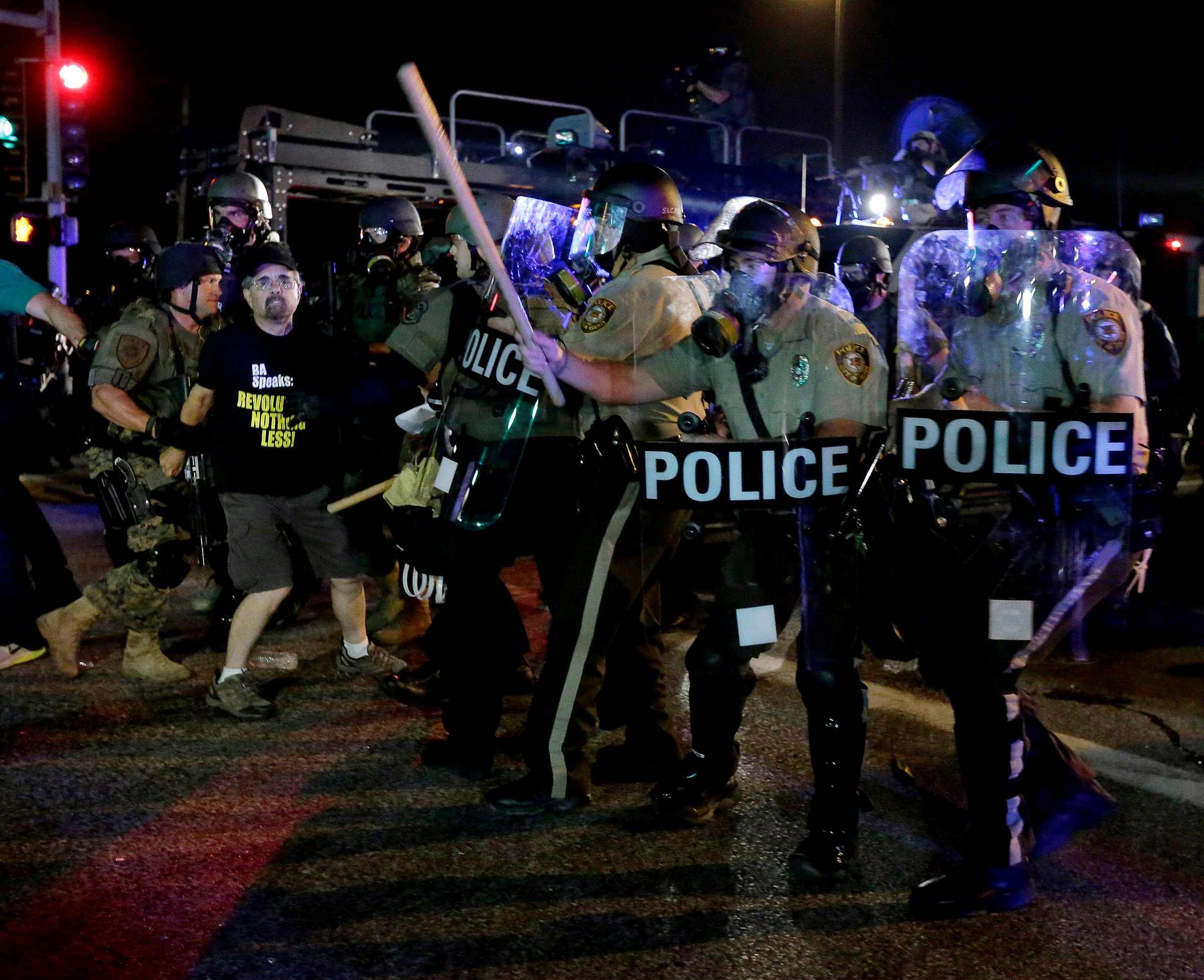 A man is detained after a standoff between protesters and police on Aug. 18, 2014 in Ferguson, Mo.
