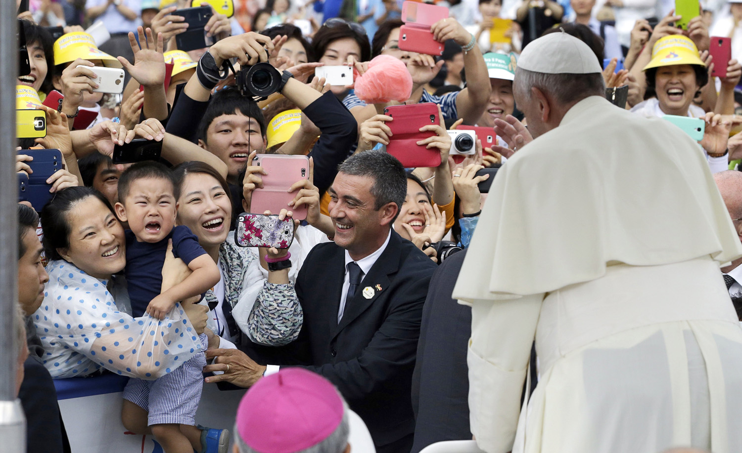 The Pope gives his blessings as he arrives Aug. 17 for a Mass in the town of Haemi, south of South Korea’s capital, Seoul (Lee Jin-man—AP)