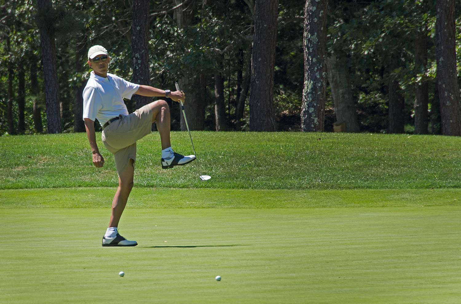 Obama tends to take a winter break in Hawaii, where he was born and raised, and a summer vacation in Martha's Vineyard. In between, he plays basketball and has been known to do some skeet shooting at Camp David. His favorite pastime, no matter the location, has become easy to spot: golf. (Jim Watson—AFP/Getty Images)