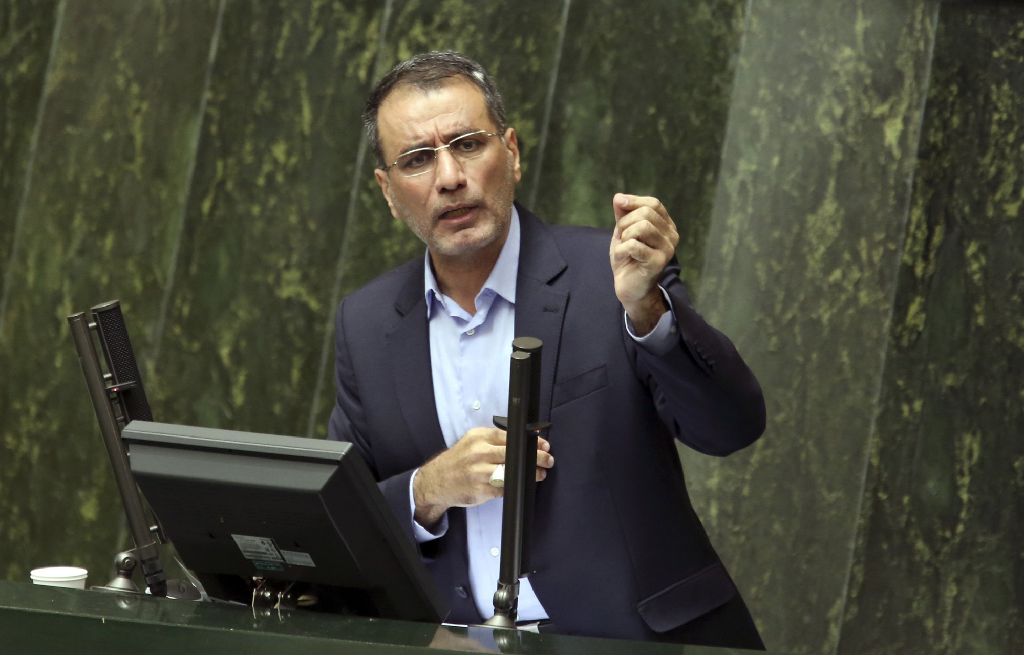Iran's Science, Research and Technology Minister Reza Faraji Dana speaks during his impeachment in an open session of the parliament in Tehran, Aug. 20, 2014.