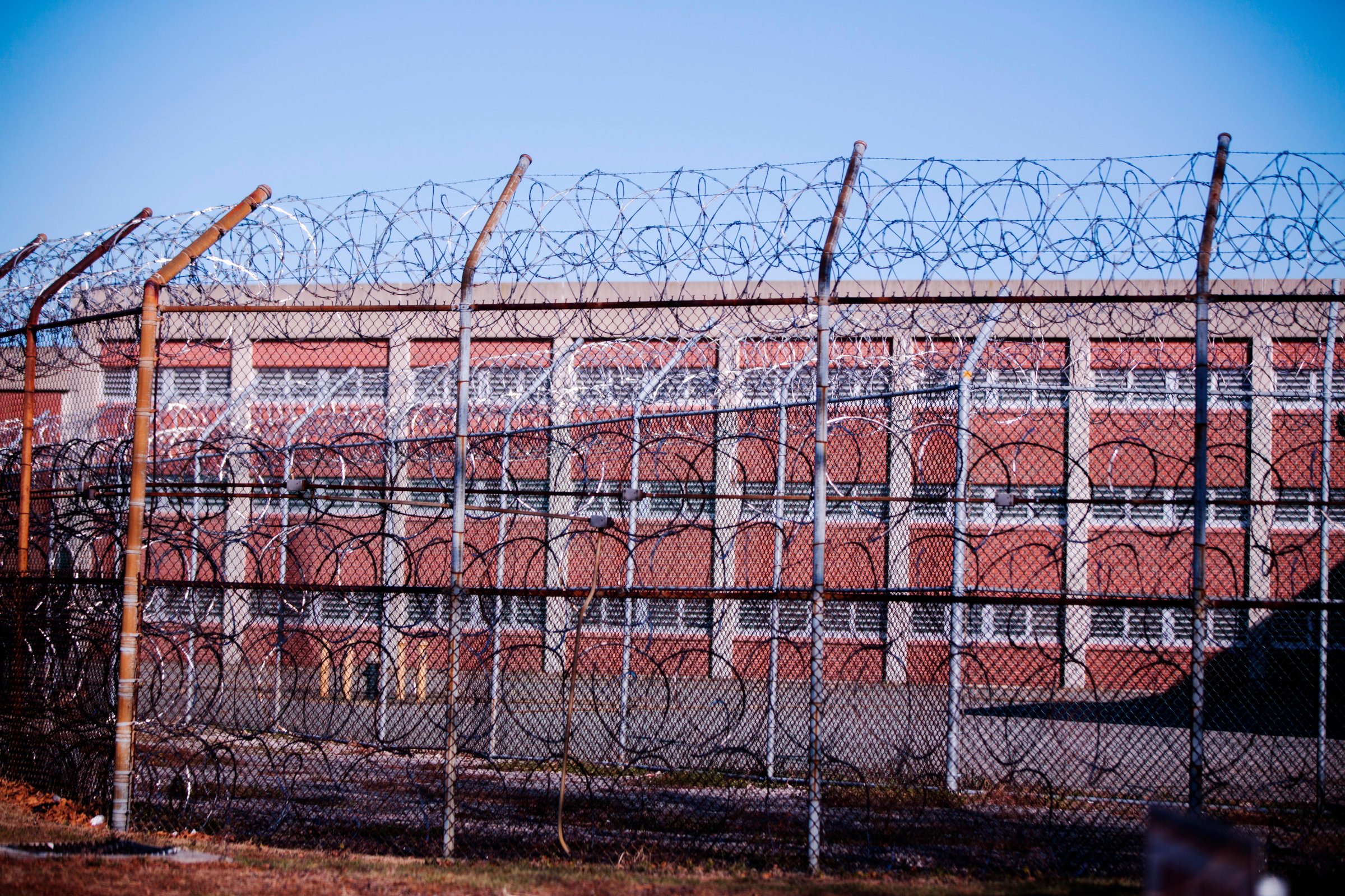 Barbed wire fences surround a building on Rikers Island Correctional Facility in New York on Dec. 24, 2013.