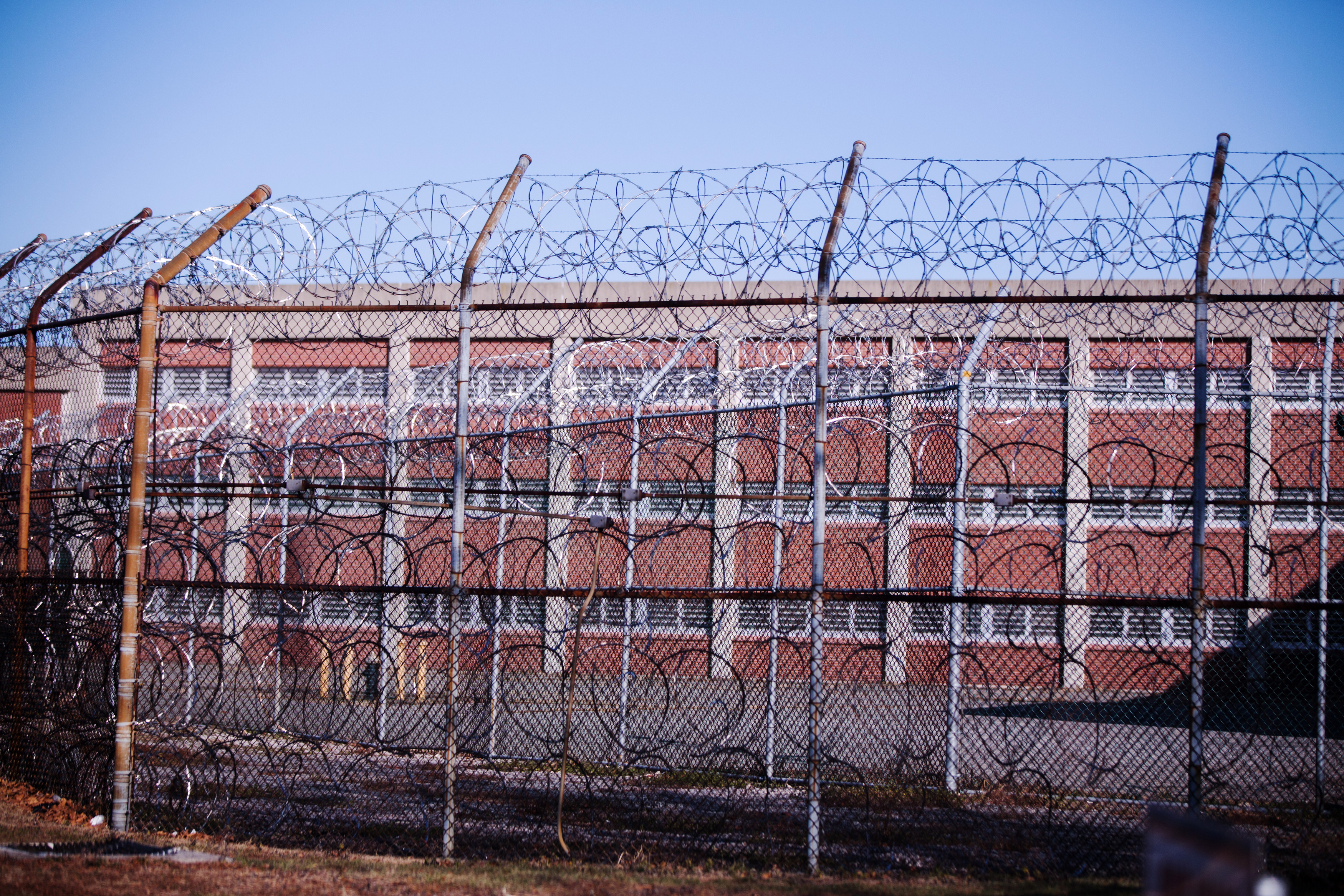 Barbed wire fences surround a building on Rikers Island Correctional Facility in New York on Dec. 24, 2013. (Lucas Jackson—Reuters)