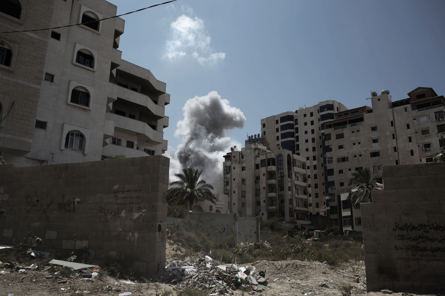 Aug. 9, 2014. Smoke rises after the impact of an airstrike in the Ansar neighbourhood in Gaza City.