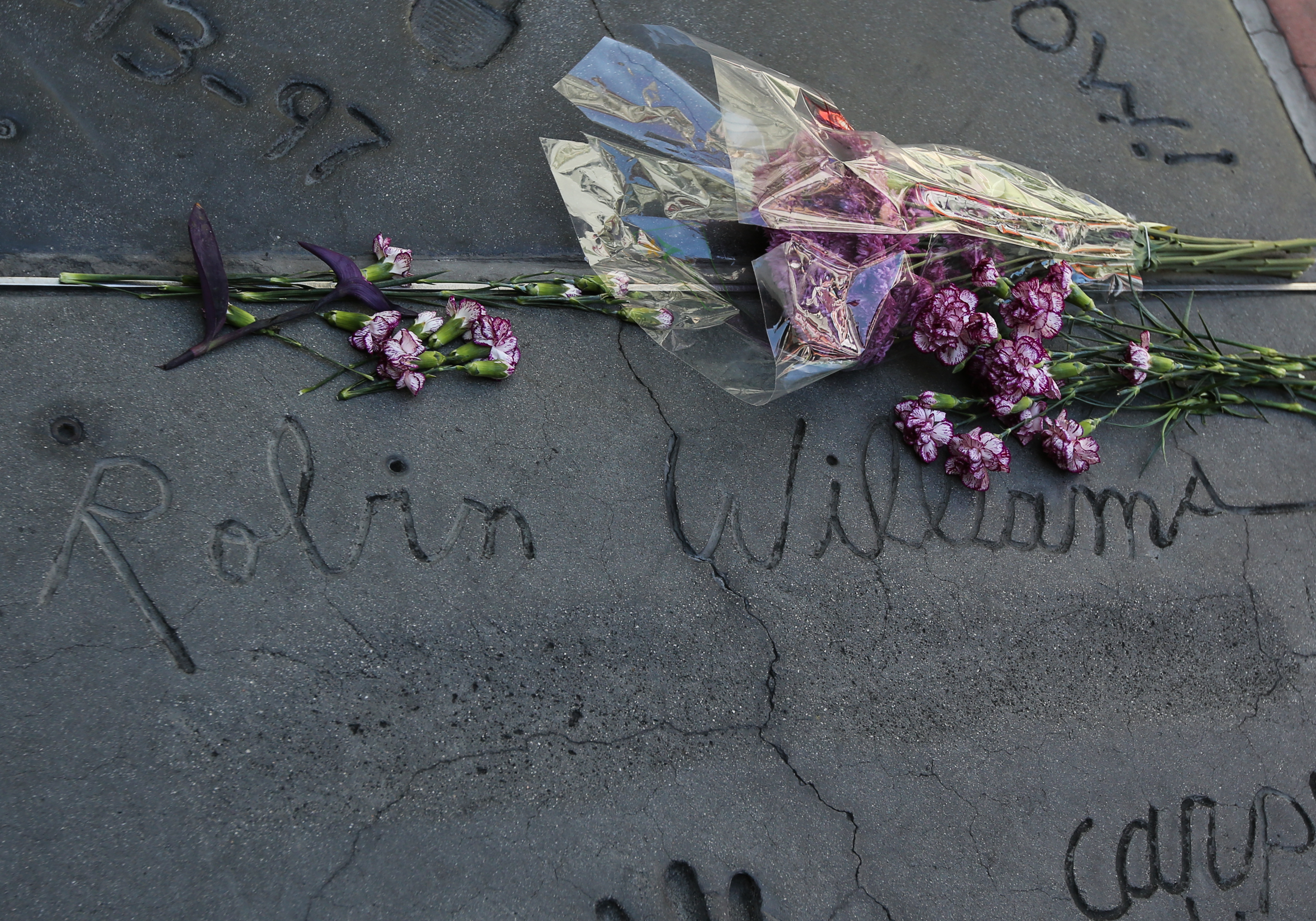 Sad Goodbye: Where Robin Williams once stood, flowers now lay (Paul Archuleta—FilmMagic/Getty Images)
