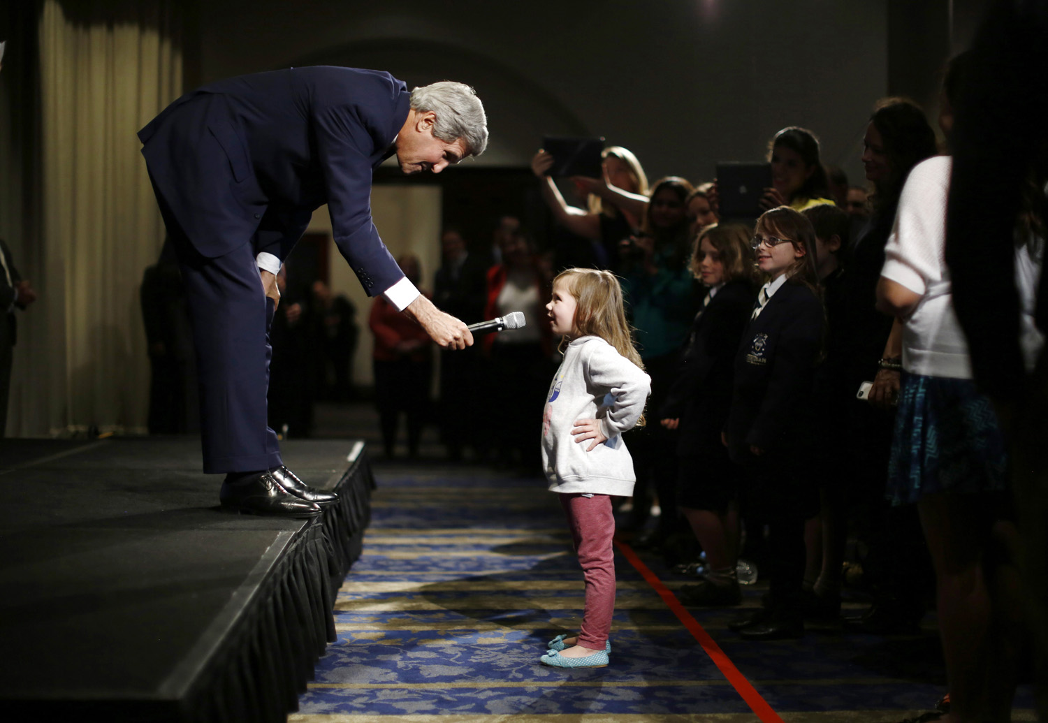U.S. Secretary of State John Kerry speaks with five-year-old Dara Edwards, the daughter of an American staffer at the U.S. Consulate in Sydney, as he meets embassy and consular staff in Sydney on August 12, 2014.
