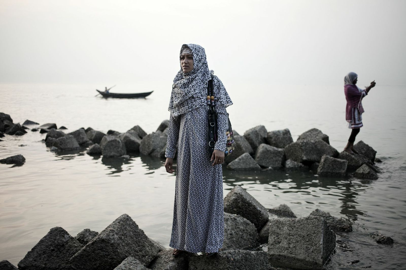 A woman poses for a picture at the entrance to the Sundarbans forest area in Bangladesh, April 2014.