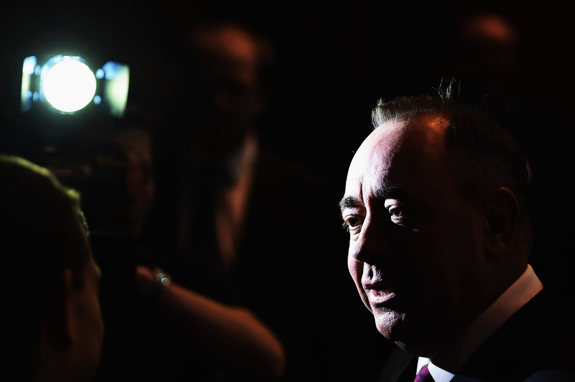 Alex Salmond, First Minister of Scotland, talks the media after debating with Alistair Darling chairman of Better Together in a televised event from the Royal Conservatoire of Scotland on August 5, 2014 in Glasgow, Scotland. (Jeff J Mitchell—Getty Images)