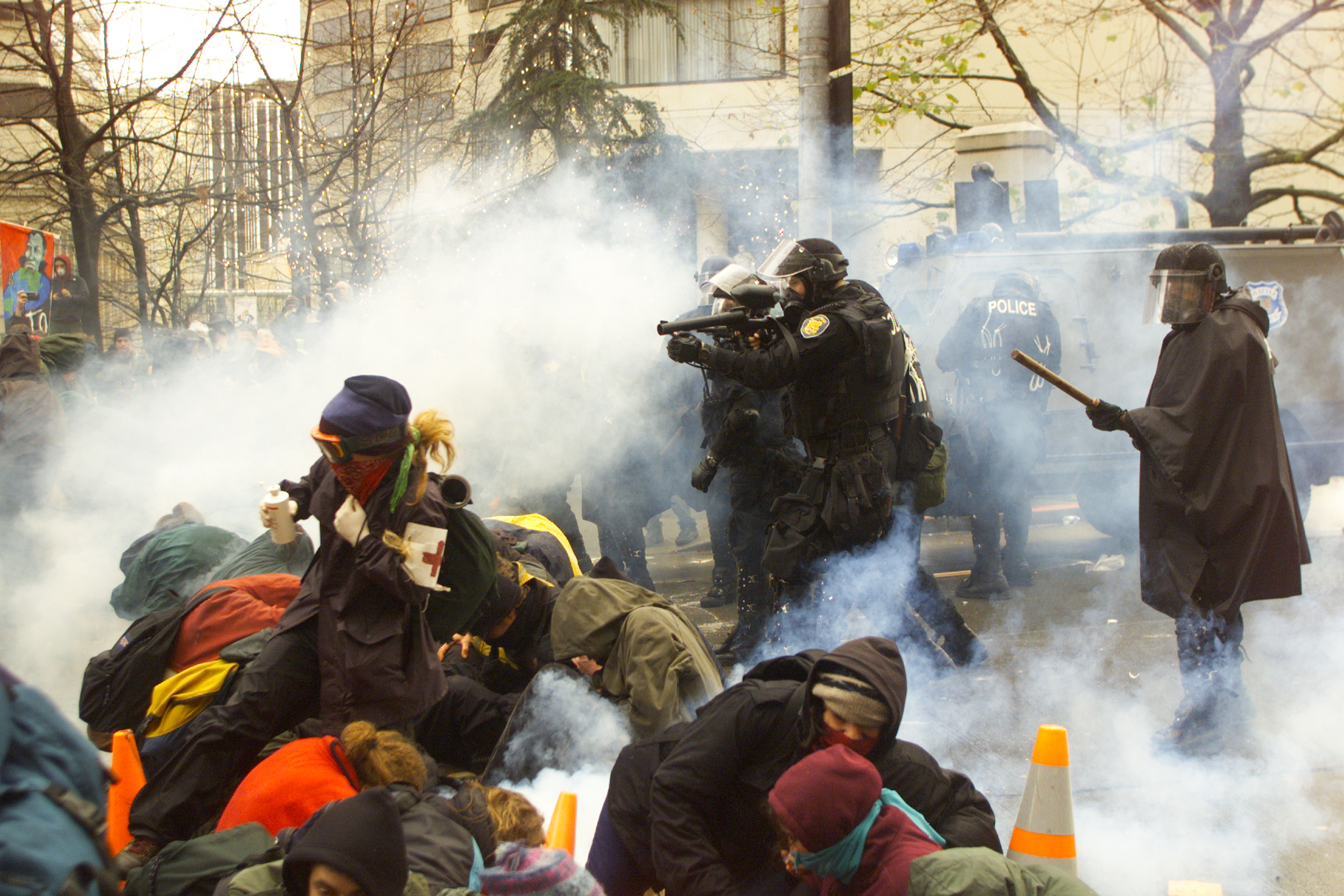 Seattle police fire teargas and pellets at protesters outside the World Trade Organization conference in Seattle, Washington on November 30, 1999.