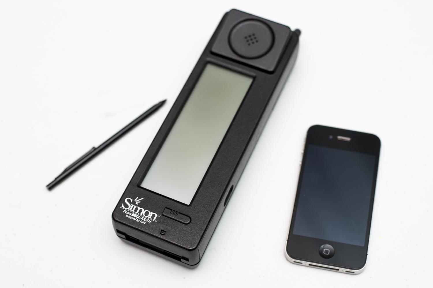 An original IBM Simon Personal Communicator is placed next to an Apple iPhone 4S at the Science Museum on August 15, 2014 in London, England (Rob Stothard / Getty Images)