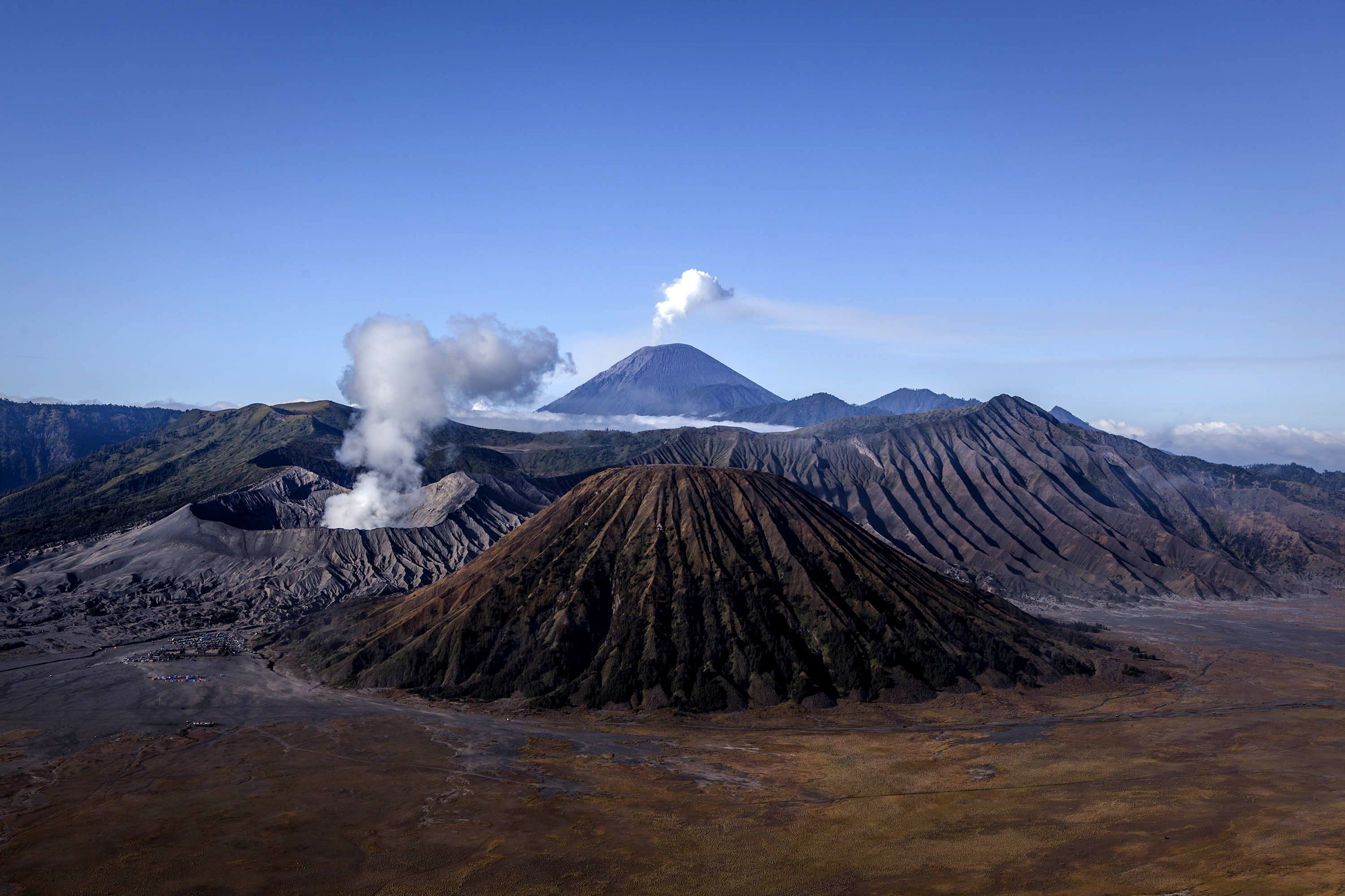 General view of the Bromo Tengger Semeru National Park, with Mount Bromo, the location of the Tenggerese villages where the Tenggerese Hindu Yadnya Kasada Festival is held on August 11, 2014 in Probolinggo, Java, Indonesia.