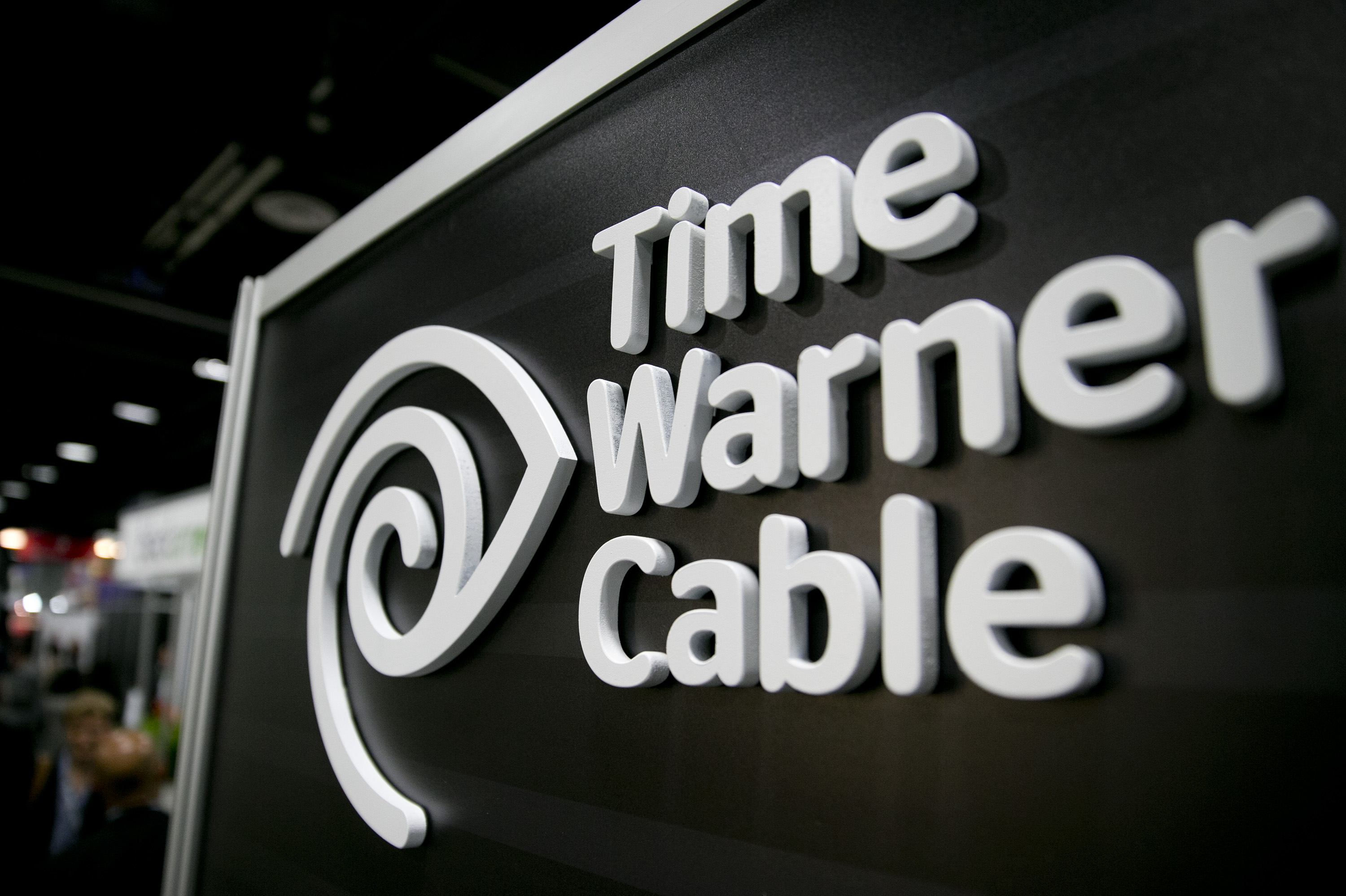 The Time Warner Cable Inc. logo is seen on the exhibit floor during the National Cable and Telecommunications Association (NCTA) Cable Show in Washington, D.C., U.S., on Tuesday, June 11, 2013. (Bloomberg—Bloomberg via Getty Images)