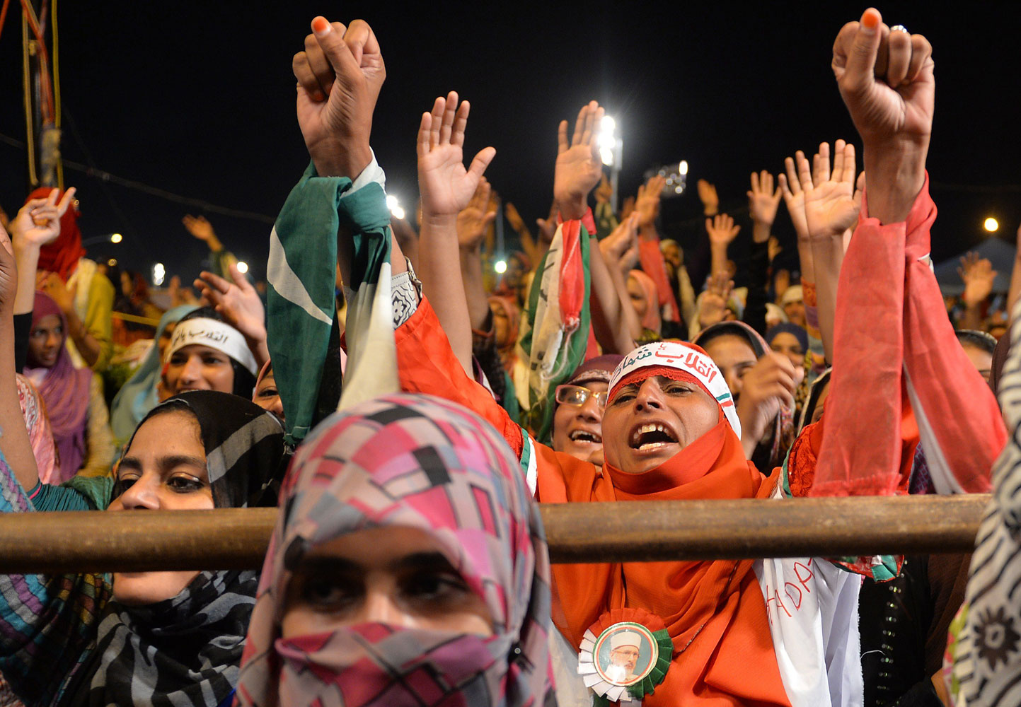 Pakistani supporters of Canada-based preacher Tahir-ul-Qadri shout anti-government slogans during a protest in front of the Parliament in Islamabad on Aug. 29, 2014. (Aamir Qureshi—AFP/Getty Images)