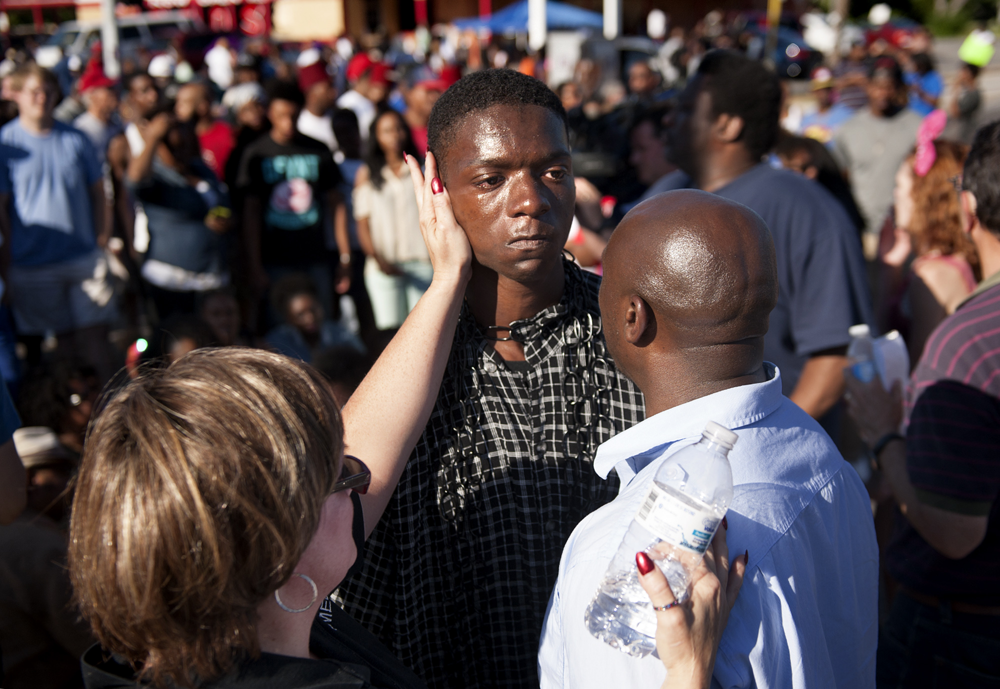 The Rev. Willis Johnson confronts 18-year-old Joshua Wilson as protesters defy police and block traffic on West Florissant Avenue at Canfield Drive in Ferguson, Mo. on Aug. 13, 2014.