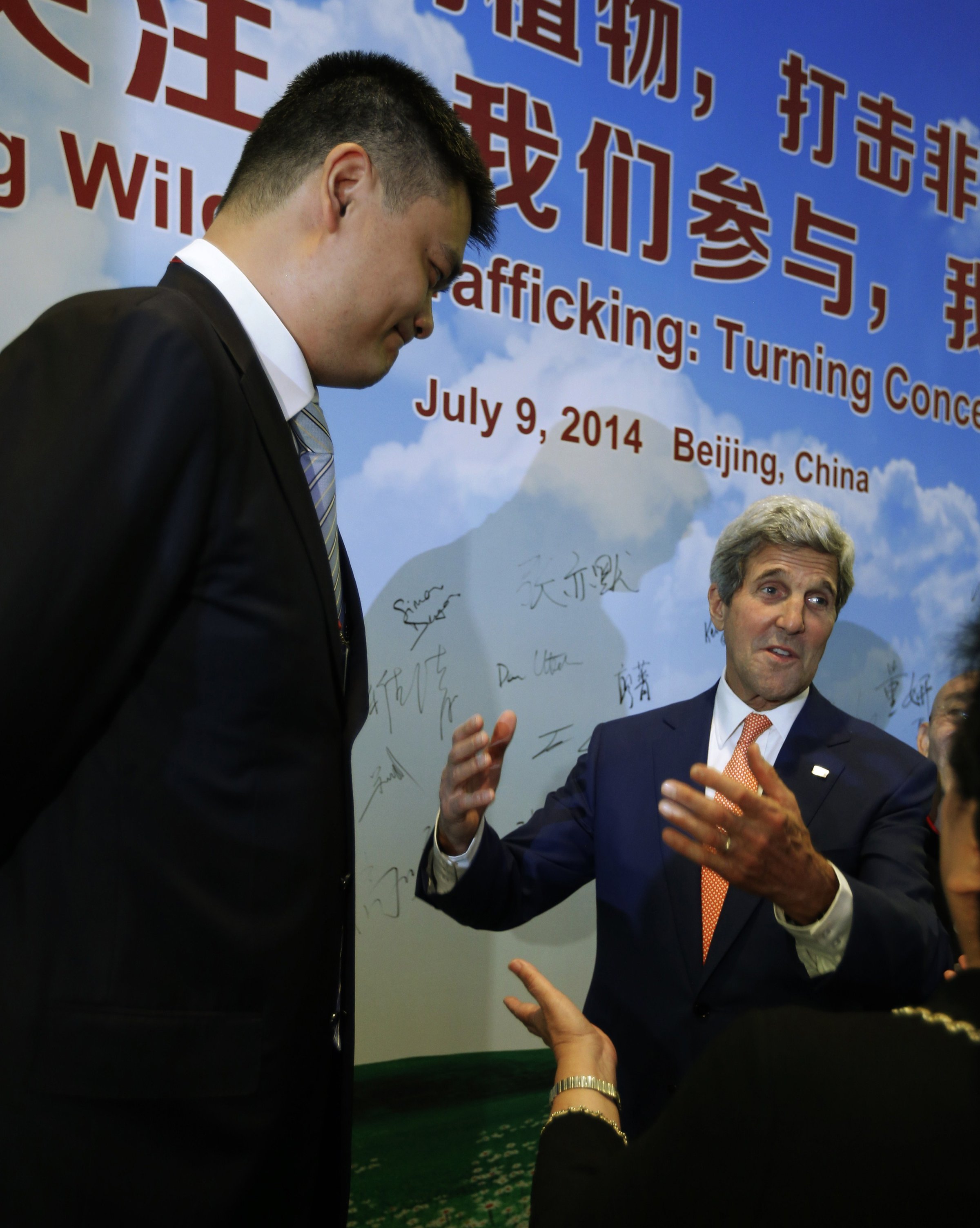 US Secretary of State John Kerry talks with retired Chinese NBA basketball star Yao Ming about his efforts against international wildlife trafficking, as the two participate in an event about combating the trade of animal remains, at the US-China Strategic and Economic Dialogue talks at the Diaoyutai State Guesthouse in Beijing on July 9, 2014.
