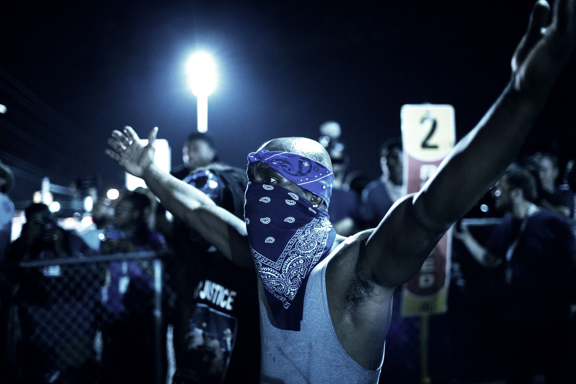 A protestor demonstrates in Ferguson, Mo. on Aug. 19, 2014. (Andrew Cutraro—REDUX for TIME)