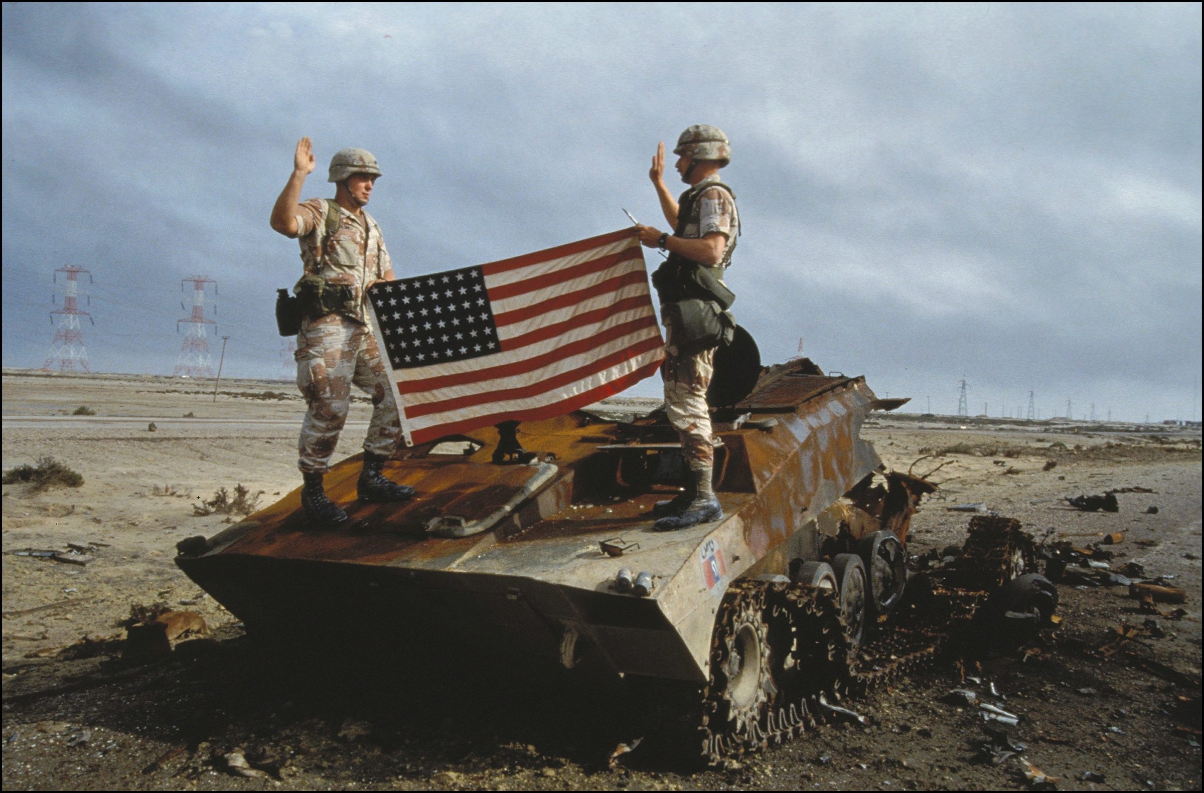 US soldiers take oath to the US army on an Iraqi destroyed tank in Iraq on February 27th, 1991.