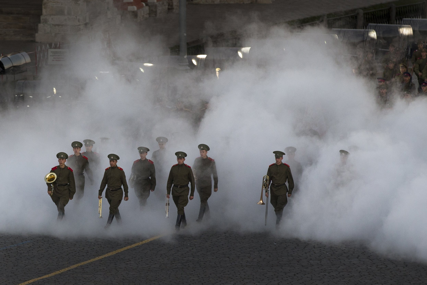 Sept. 7, 2014. Russian military band members dressed in Russian World War I military uniforms march through a fog in memory of the 100th anniversary of its beginning during the closing ceremony of  Spasskaya Tower  International Military Orchestra Music Festival at the Red Square in Moscow, Russia.