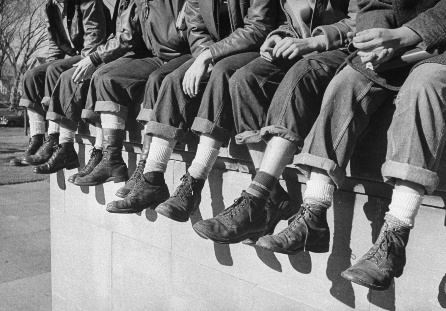 Tuesday's shoes are current phenomenon in Des Moines. Every Tuesday high-school boys wear GI shoes, bought at surplus store or inherited from an older brother and called "my old lady's" Army shoes."
