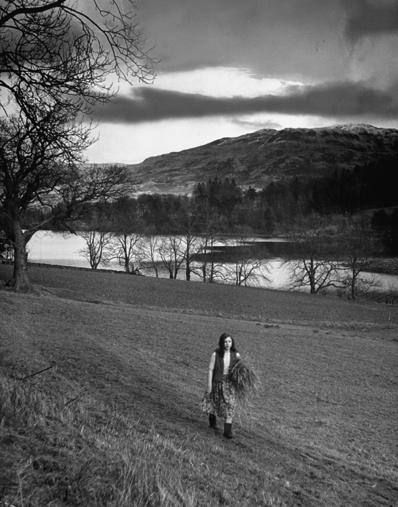 Scottish farm girl walking along a trail where Wordsworth wrote some of his poetry, 1950.