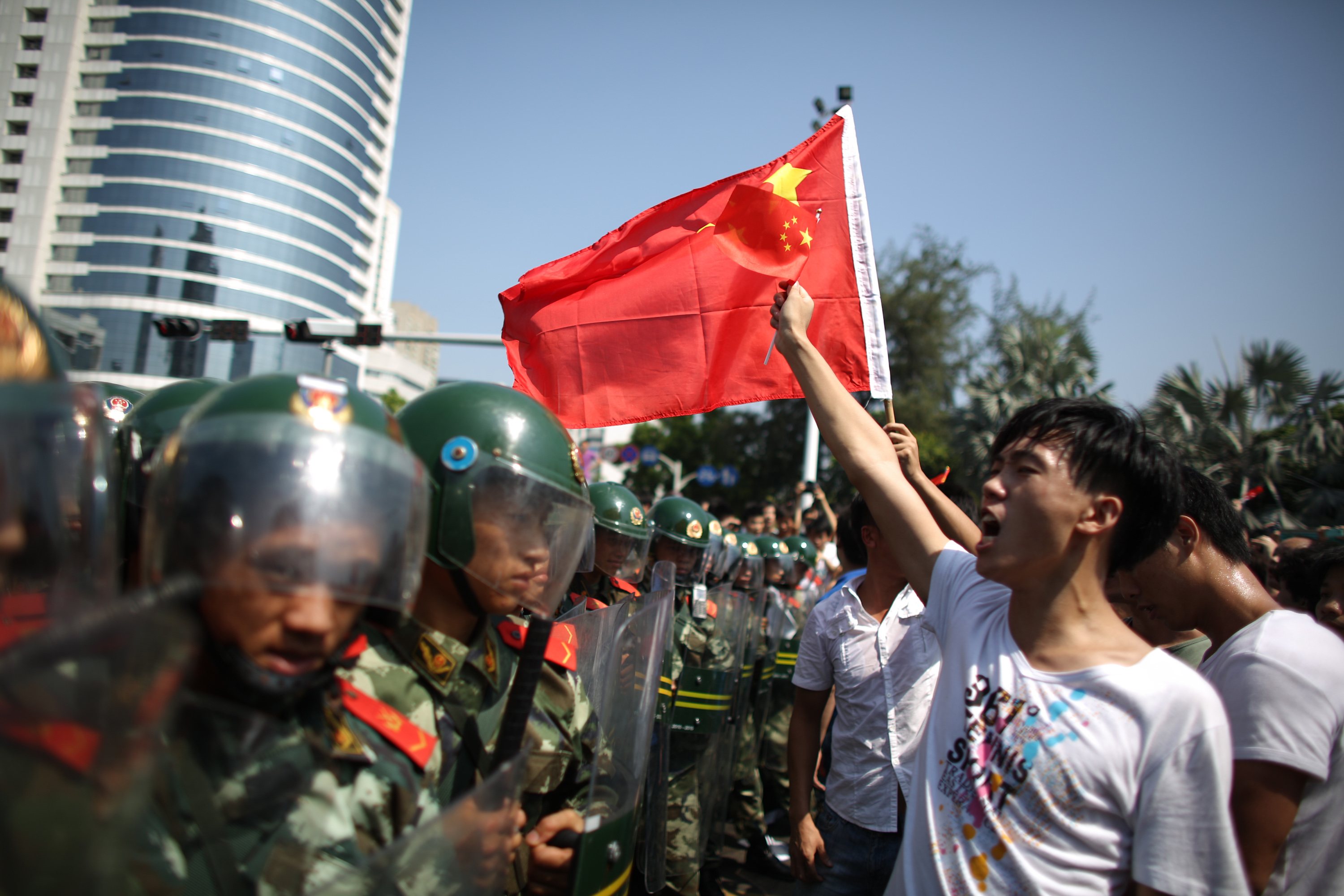 Anti-Japan protesters are confronted by police as they demonstrate over the disputed Diaoyu/Senkaku Islands on Sept. 16, 2012, in Shenzhen (Lam Yik Fei—Getty Images)