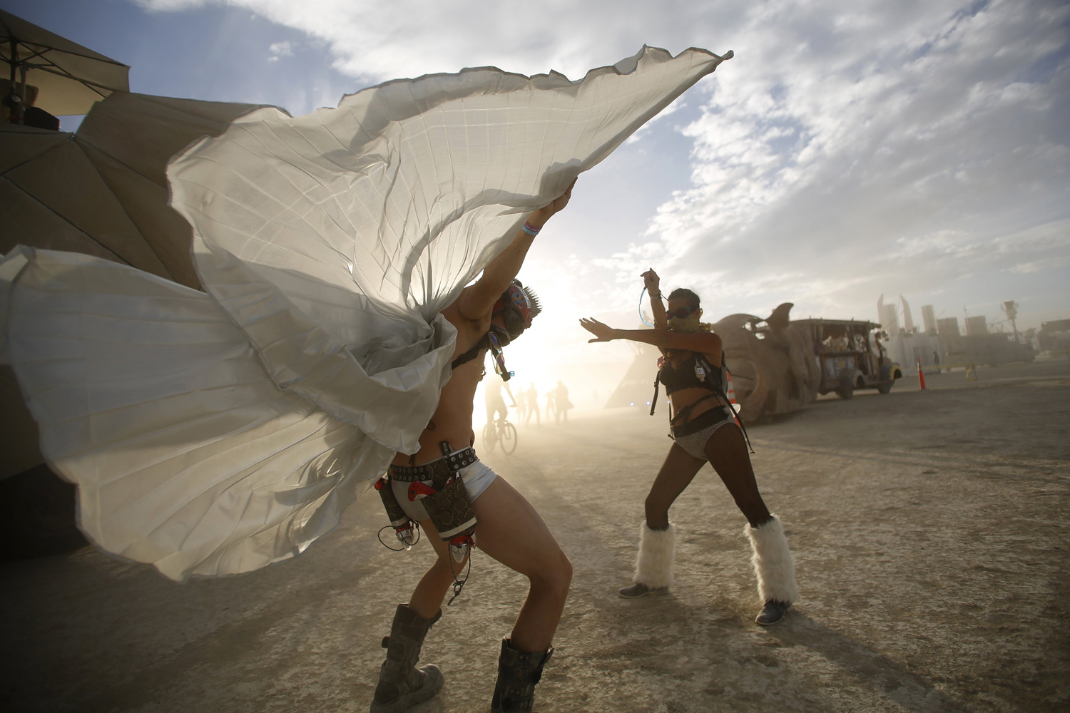 Dillon Bracken and Atalya Stachel dance during the Burning Man 2014 "Caravansary" arts and music festival in the Black Rock Desert of Nevada