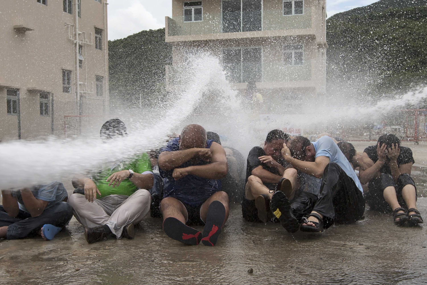Sept. 7, 2014. Pro-democracy activists are hit with water during a drill to simulate the scenario of being sprayed with a water cannon at the upcoming  Occupy Central  movement rally in Hong Kong.