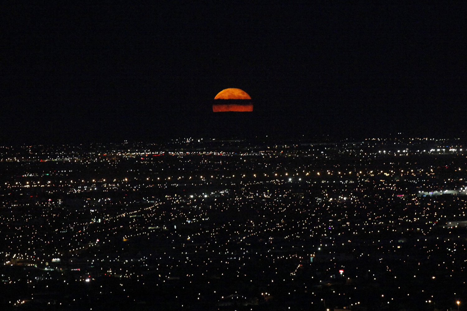 Sept. 9, 2014. A supermoon rises over Ciudad Juarez. The September full moon, also known as the Harvest Moon, is the last of this summer's three supermoons, and the final one of the year.