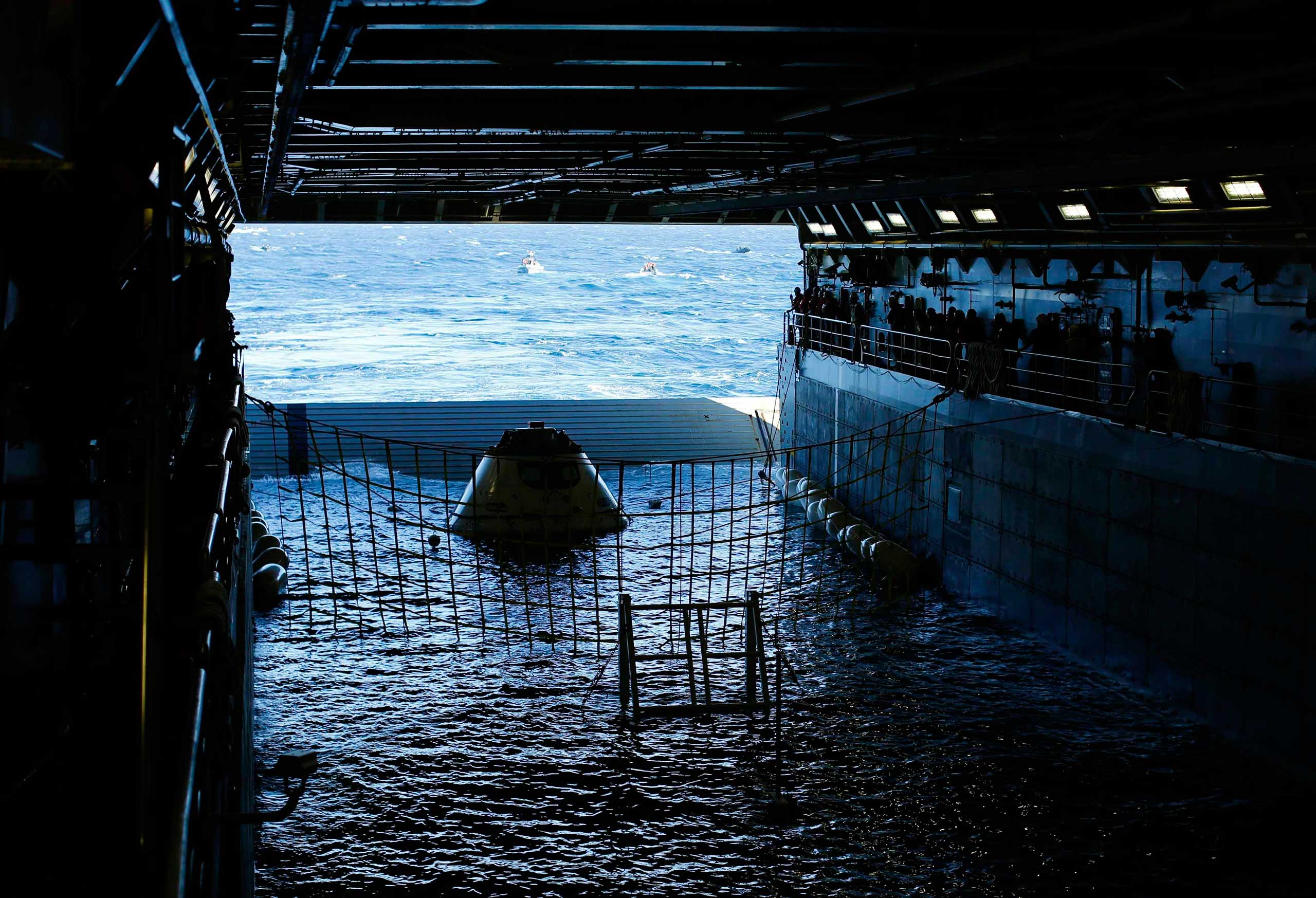 Sept. 15, 2014. A test version of NASA's Orion capsule floats in the rear of the USS Anchorage during a recovery drill off the coast of California.