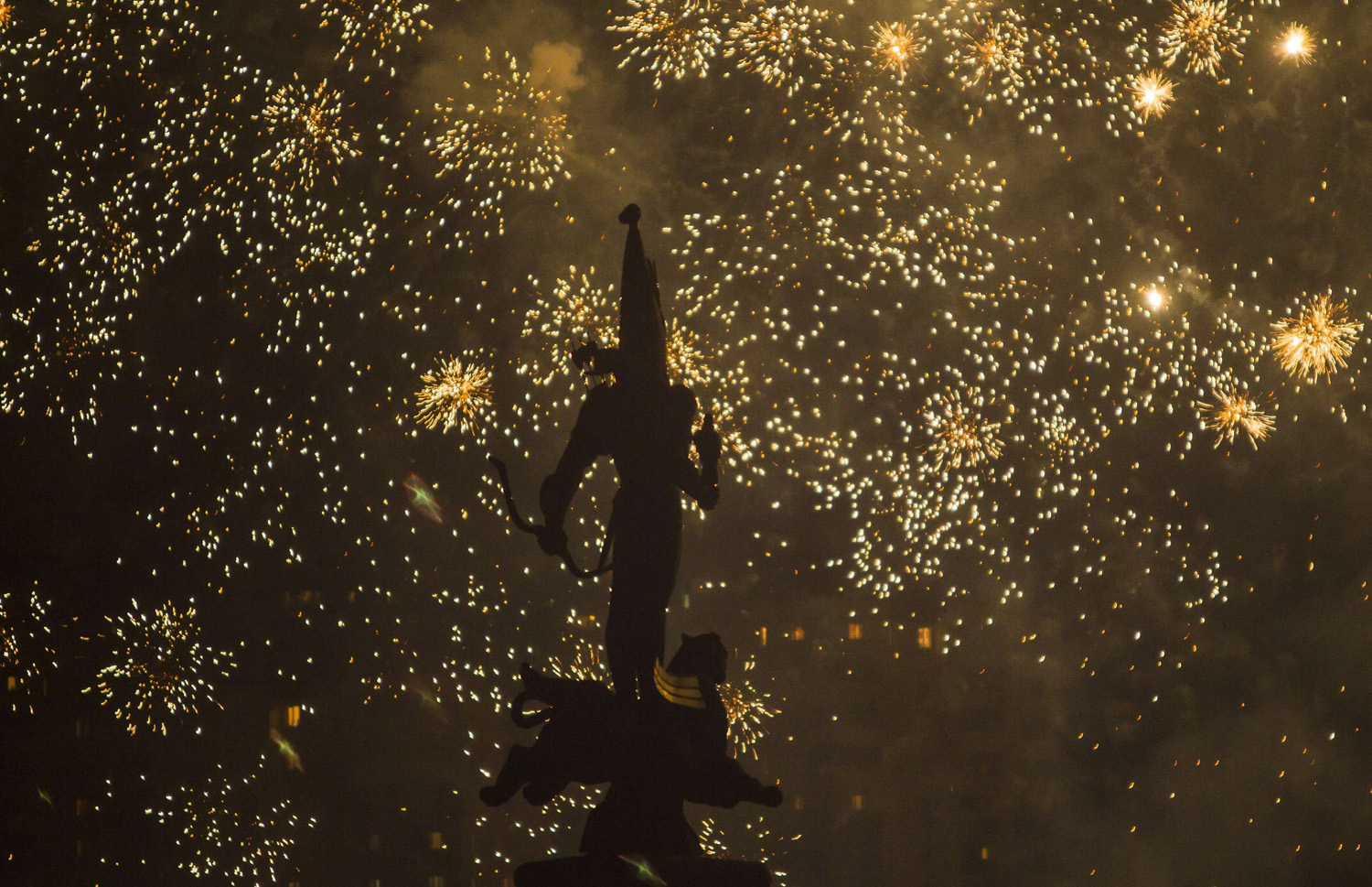 The Independence Monument is silhouetted against fireworks during City Day celebrations in Almaty