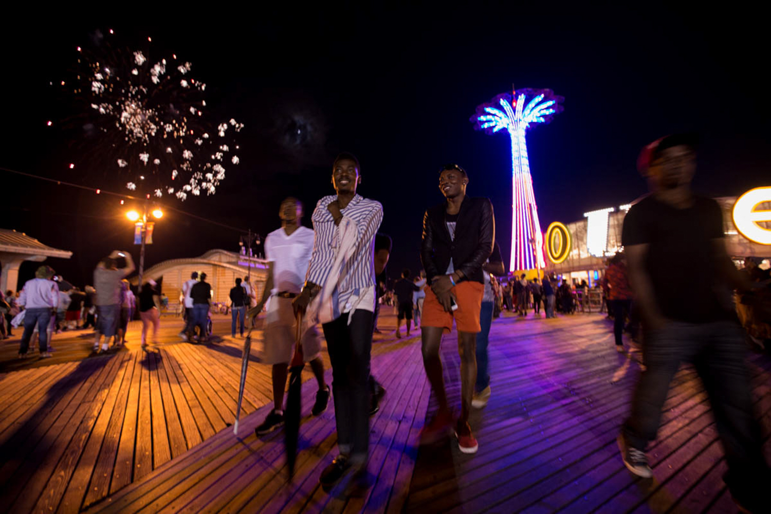 Michael Ighodaro, Williams Rashidi and friends at the Coney Island Boardwalk during the fourth of July fireworks display. Though the numbers haven’t been formally tracked, immigration equality advocates say that LGBT Nigerians, especially gay men, are increasingly looking to the United States for asylum. The exit of LGBT people seeking asylum from countries like Nigeria and Uganda, that have intolerant laws is unprecedented. Coney Island, New York, July, 2014