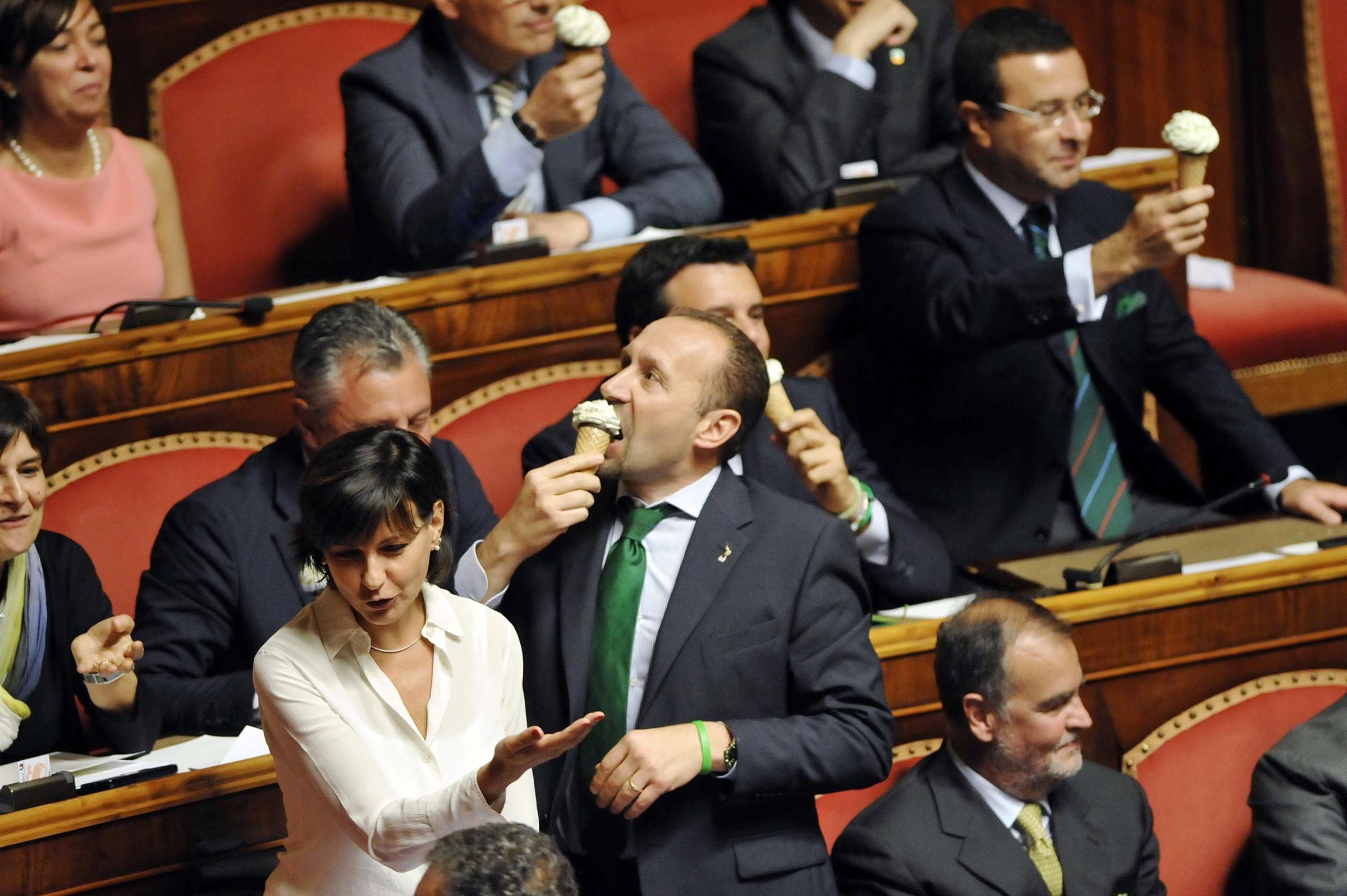 Deputies of Lega eat ice cream in the senate while Prime Minister Matteo Renzi speaks on the implementation of a government program on Sept. 16, 2014 in Rome.