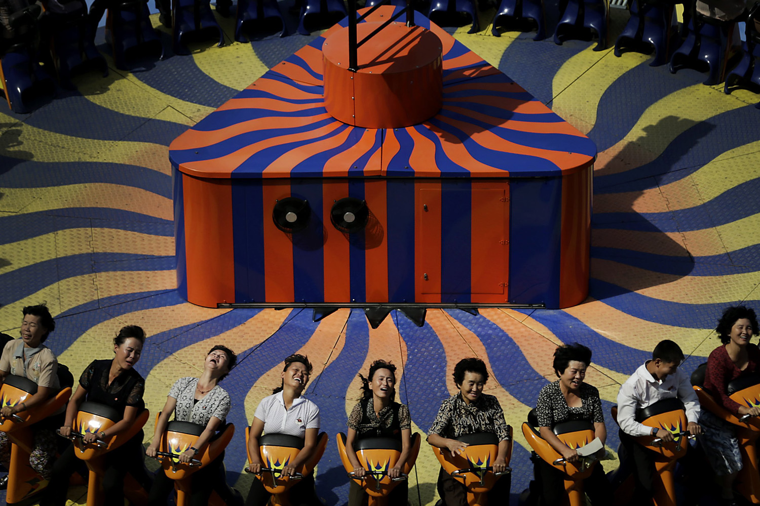 North Koreans enjoy a ride at the Kaeson Youth Amusement Park in Pyongyang on Sept. 3, 2014.